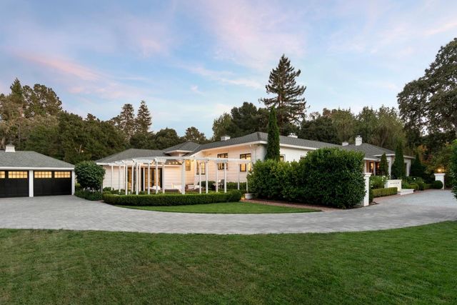 a view of house with yard and entertaining space