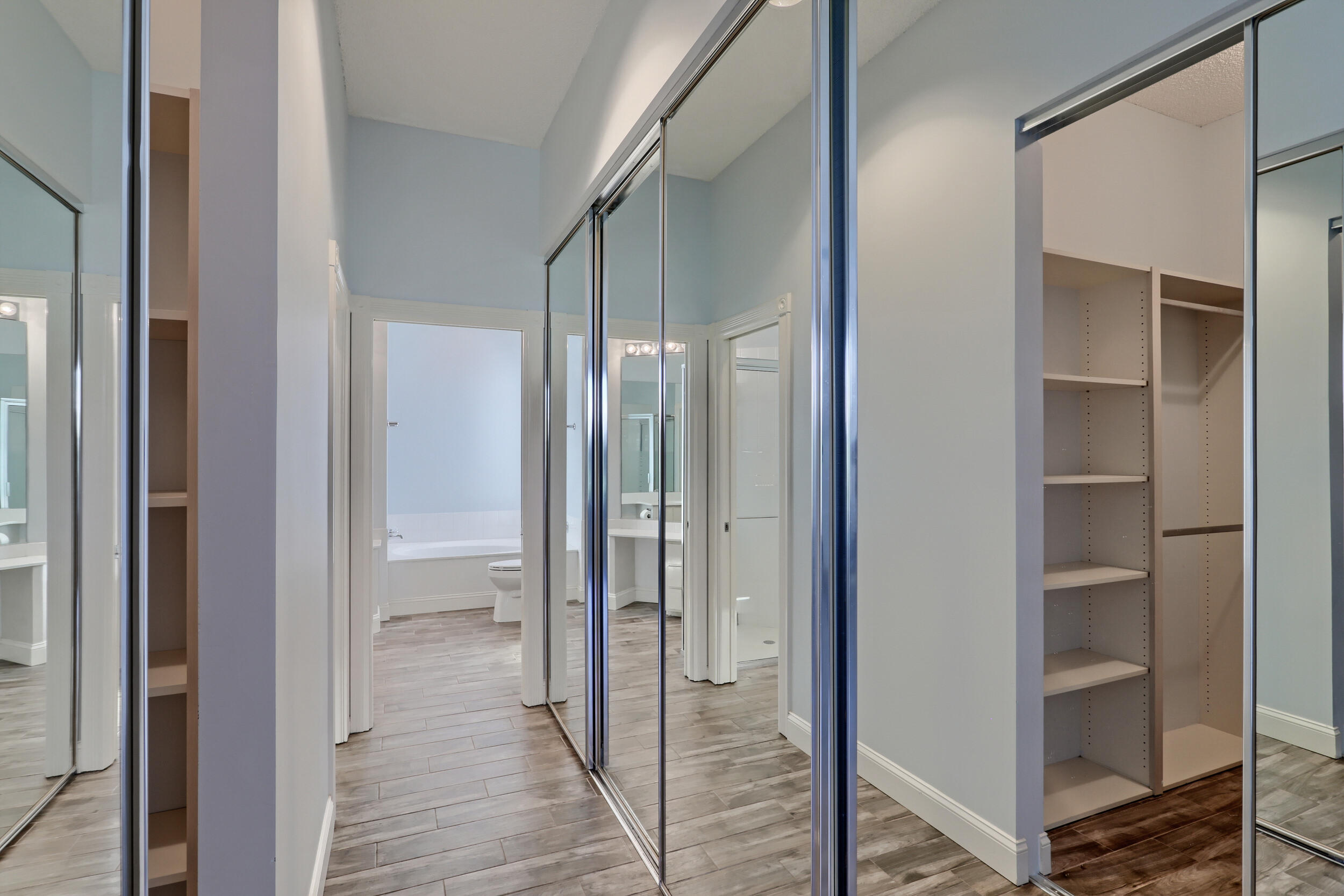 8452 Beaconhill Road Palm Beach Gardens, FL 33410 - Photo 13 of 40 a view of a bathroom from a hallway
