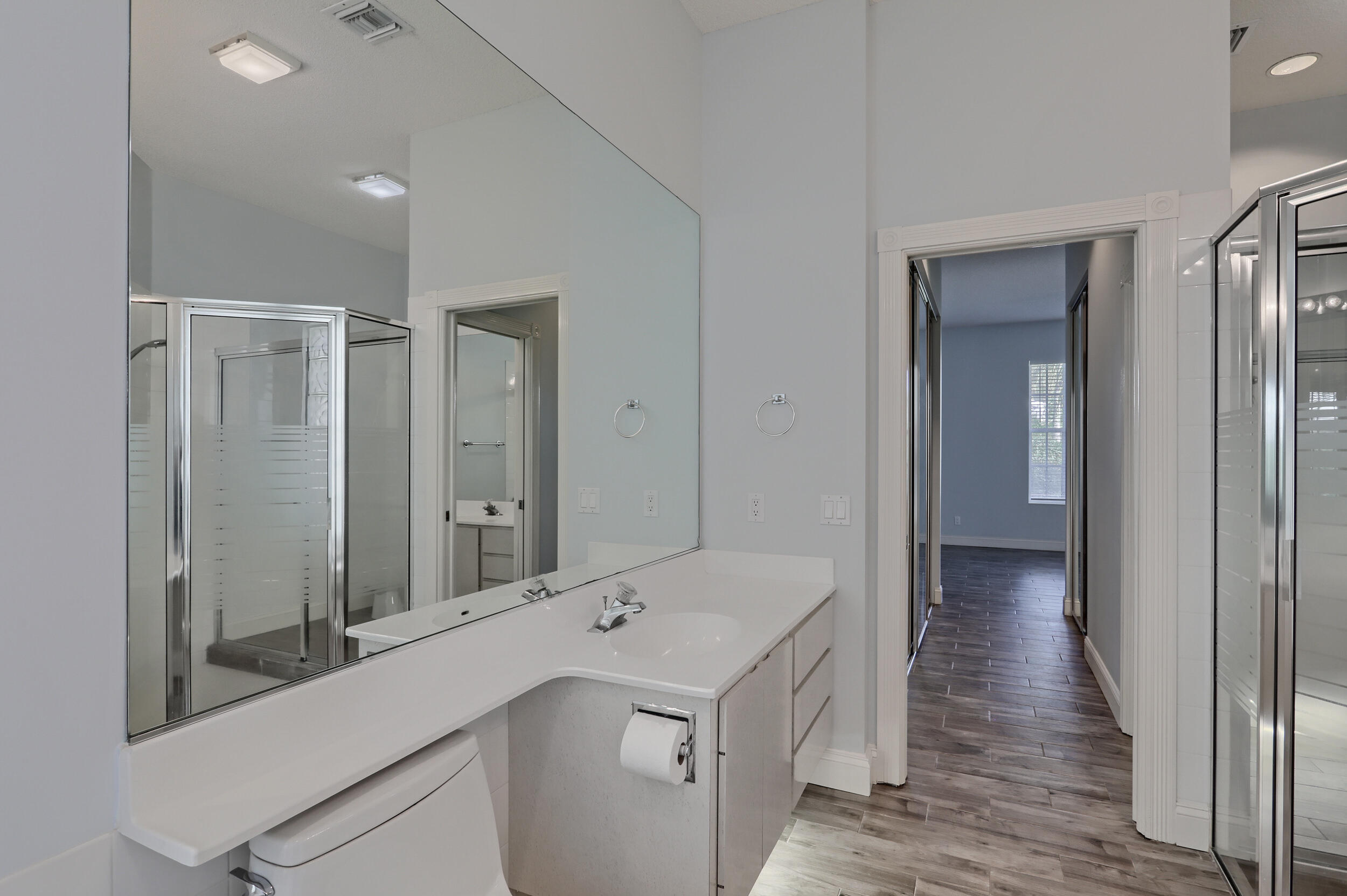8452 Beaconhill Road Palm Beach Gardens, FL 33410 - Photo 15 of 40 a view of a hallway with wooden floor