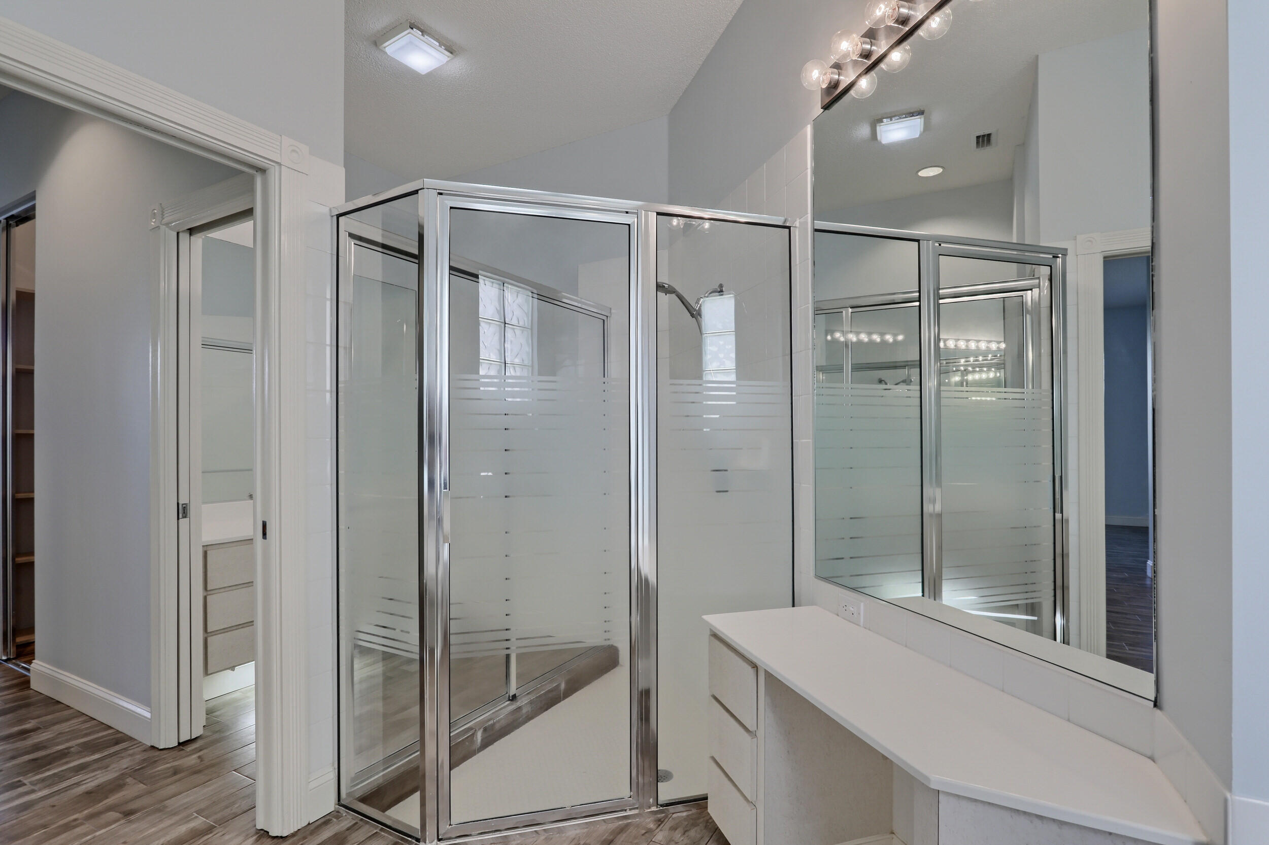 8452 Beaconhill Road Palm Beach Gardens, FL 33410 - Photo 17 of 40 a bathroom with a shower and a sink