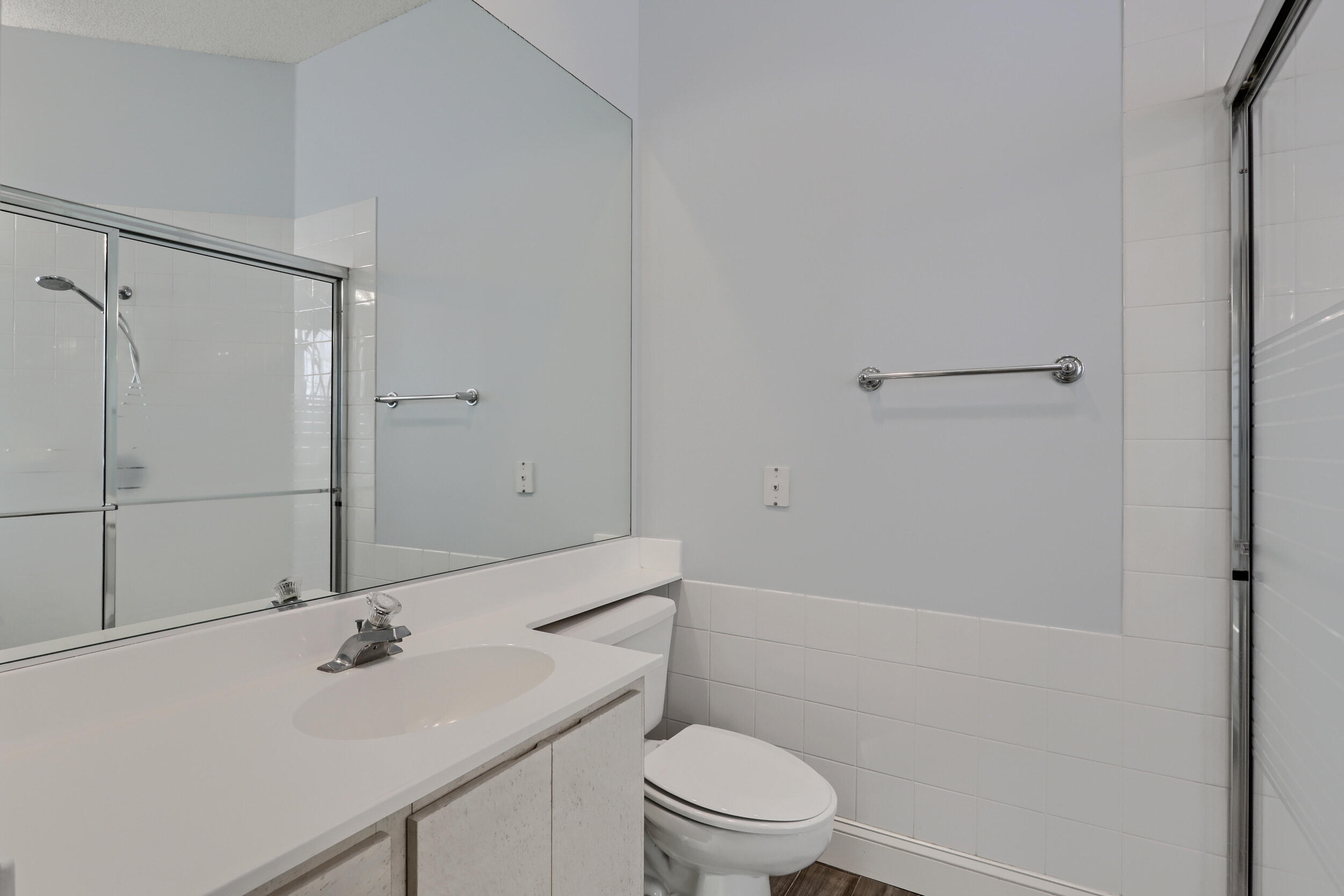 8452 Beaconhill Road Palm Beach Gardens, FL 33410 - Photo 18 of 40 a bathroom with a sink a toilet and shower