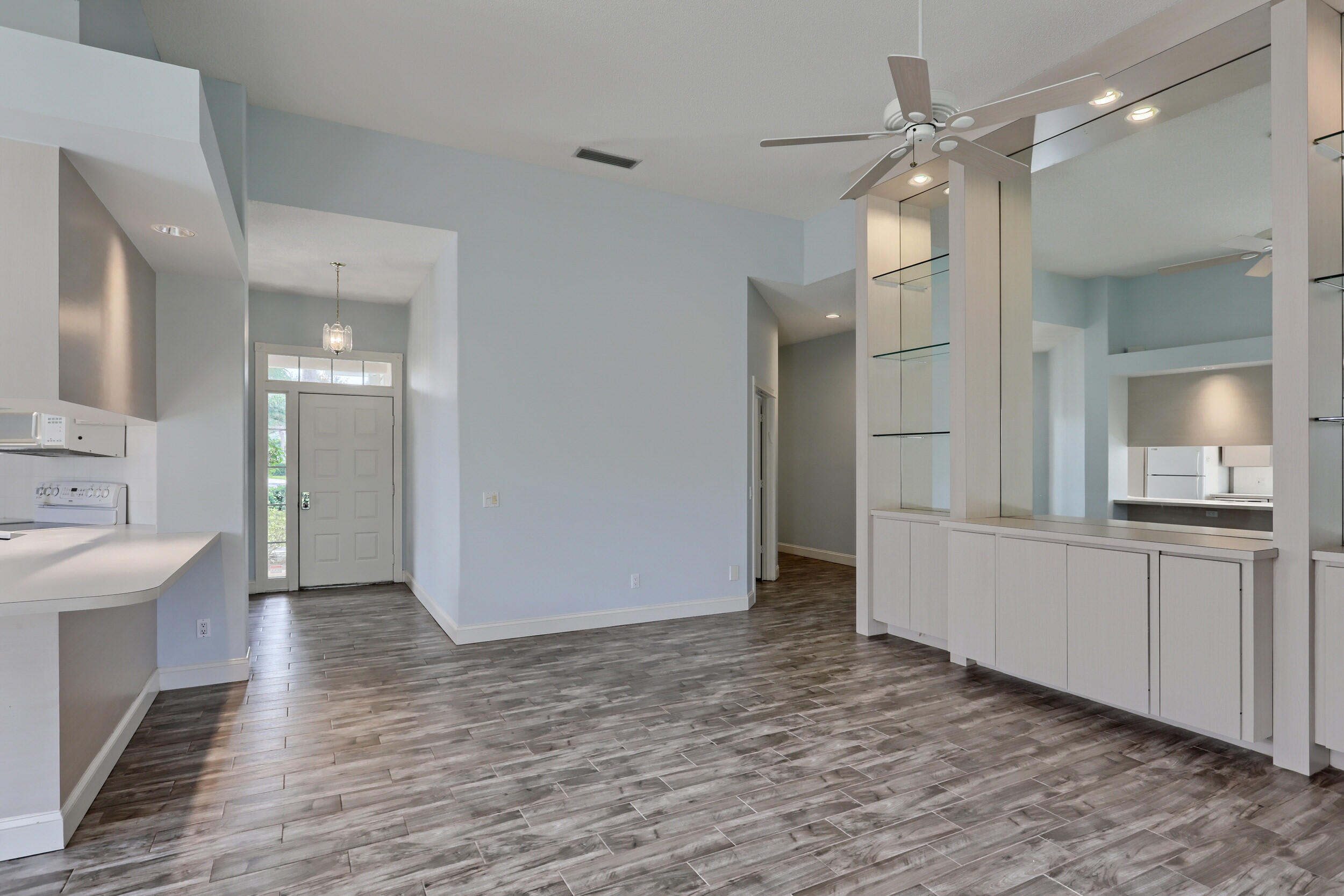 8452 Beaconhill Road Palm Beach Gardens, FL 33410 - Photo 19 of 40 a view of a kitchen cabinets and wooden floor