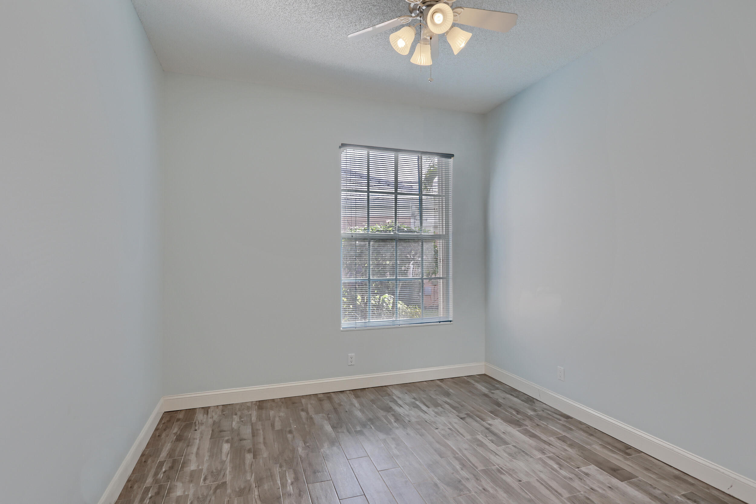 8452 Beaconhill Road Palm Beach Gardens, FL 33410 - Photo 22 of 40 an empty room with a window