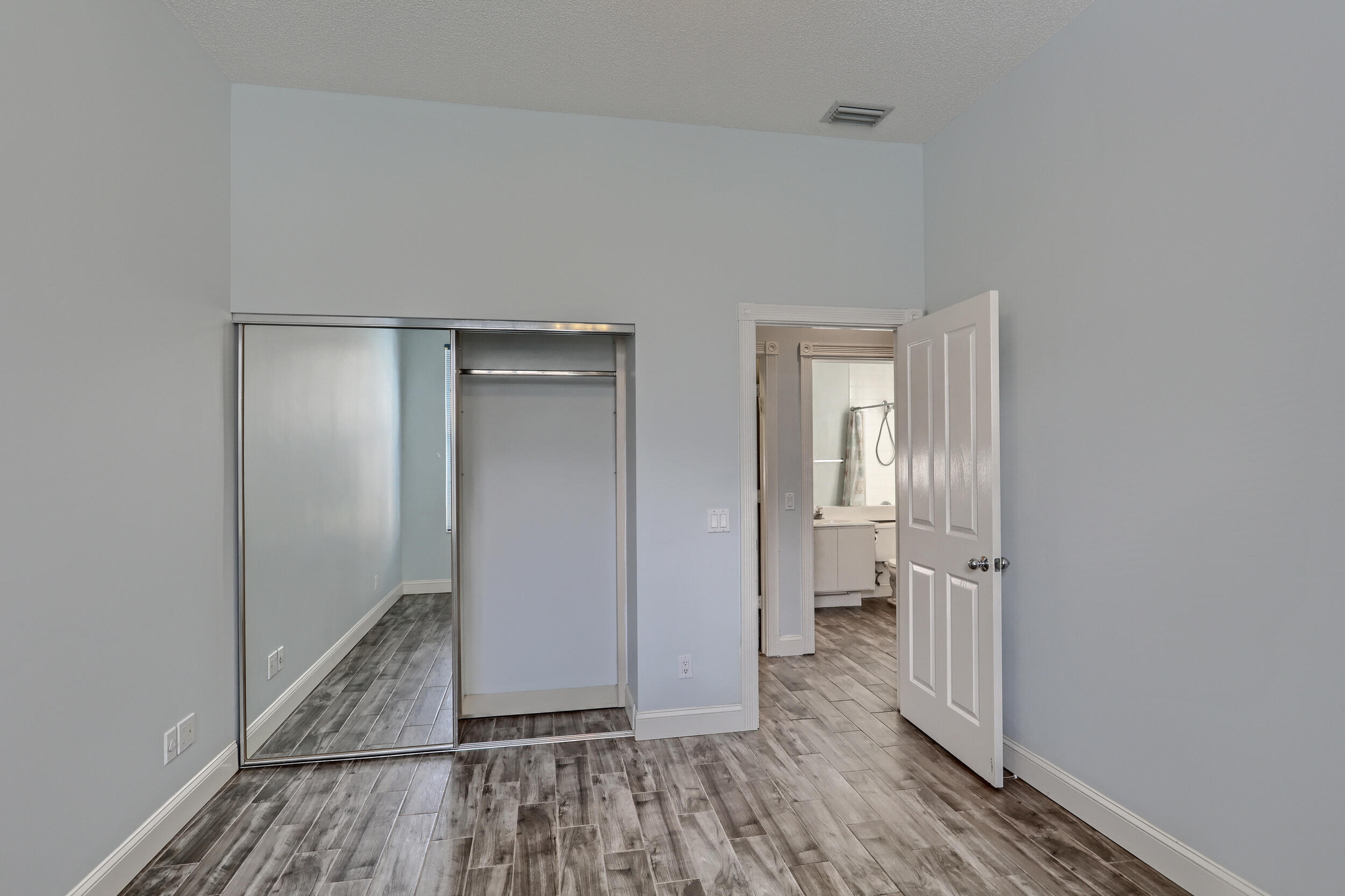 8452 Beaconhill Road Palm Beach Gardens, FL 33410 - Photo 23 of 40 a view of a room with wooden floor