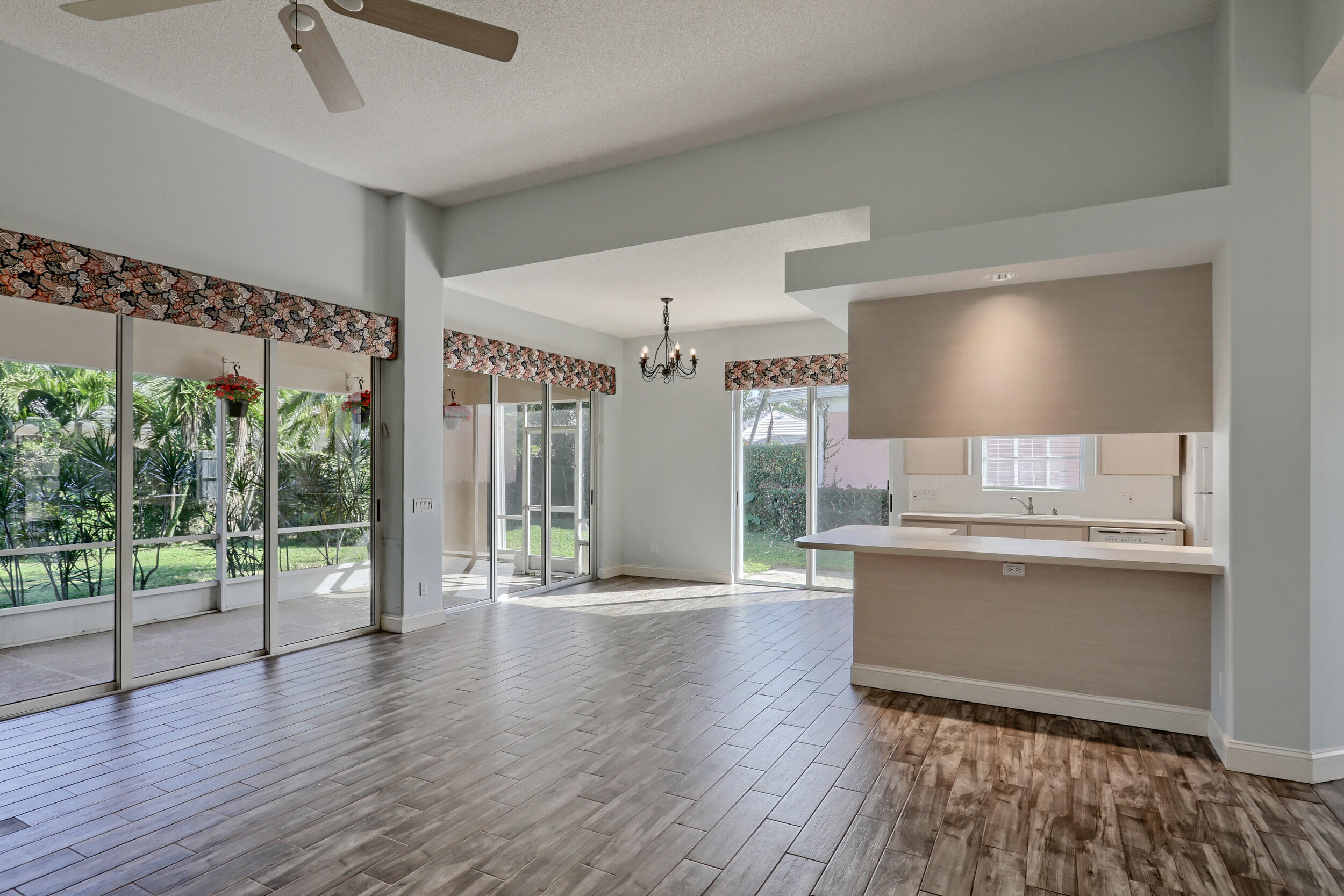 8452 Beaconhill Road Palm Beach Gardens, FL 33410 - Photo 27 of 40 a view of kitchen with furniture and wooden floor