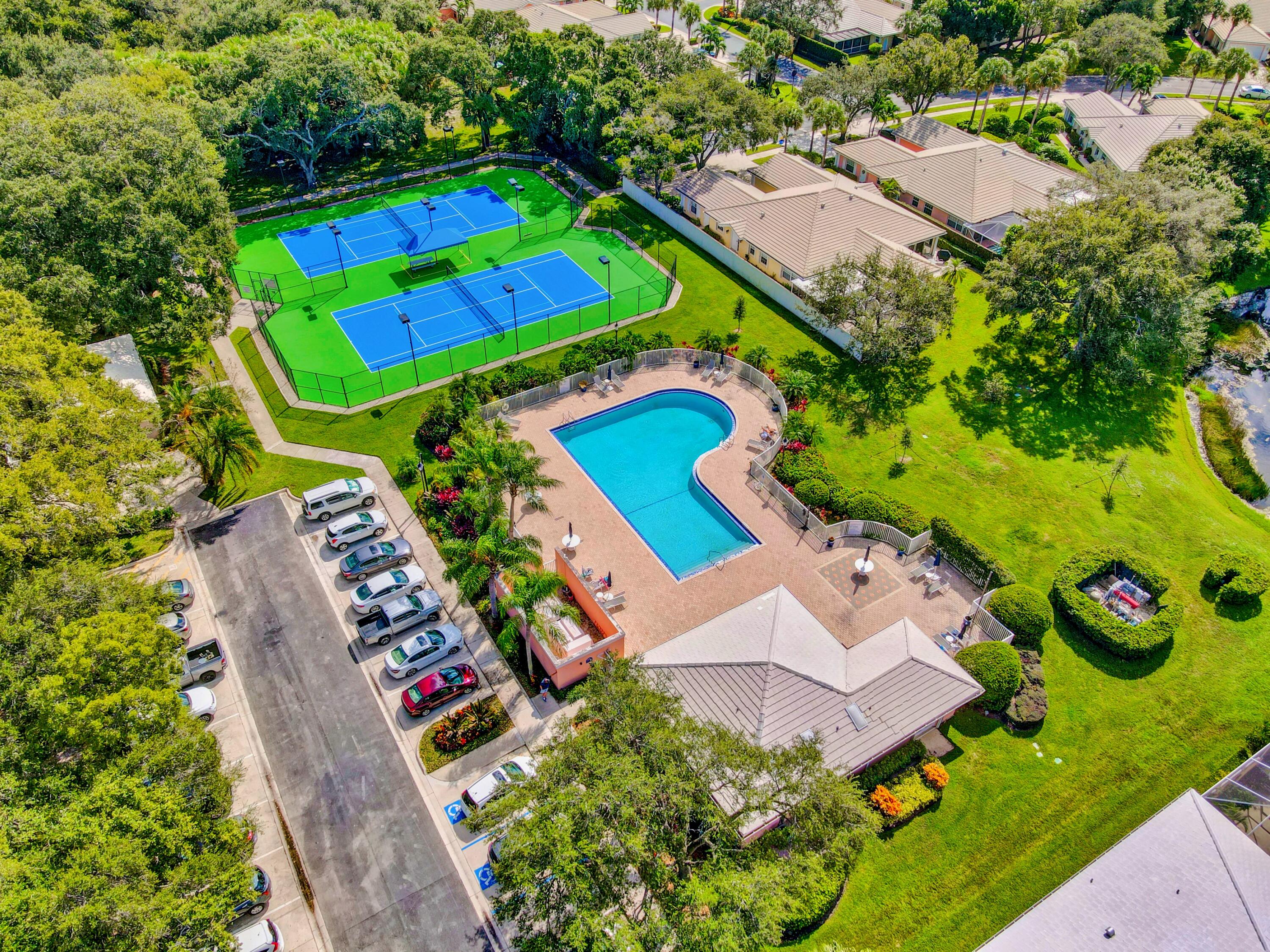 8452 Beaconhill Road Palm Beach Gardens, FL 33410 - Photo 36 of 40 an aerial view of a tennis ground and a yard