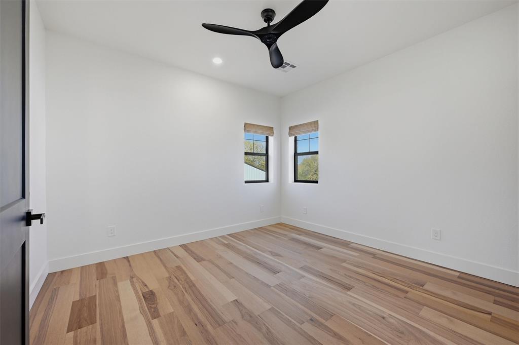1805 Arthur Road Denison, TX 75021 - Photo 30 of 40 a view of a room with wooden floor and ceiling fan