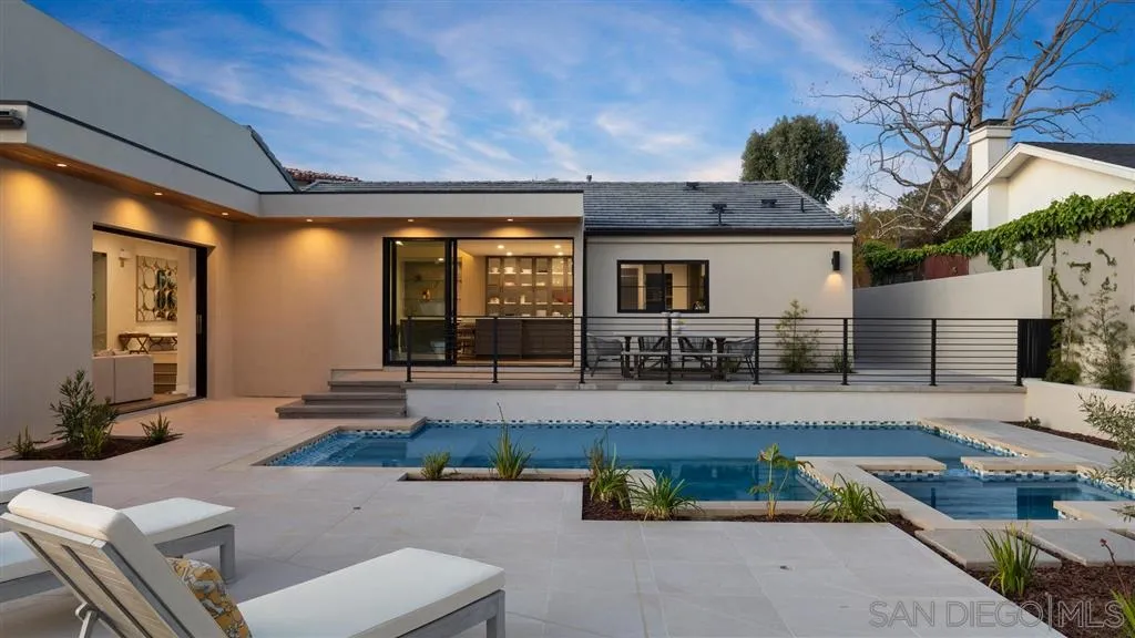 1631 Marisma Way La Jolla, CA 92037 - Photo 14 of 25 a living room with patio furniture and a fireplace
