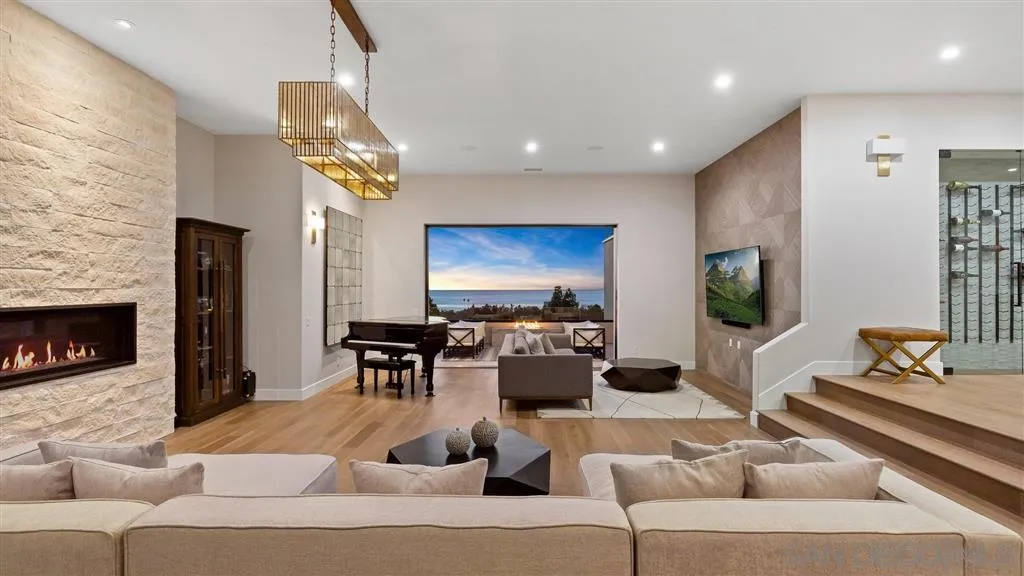 1631 Marisma Way La Jolla, CA 92037 - Photo 19 of 25 a living room with furniture and a fireplace