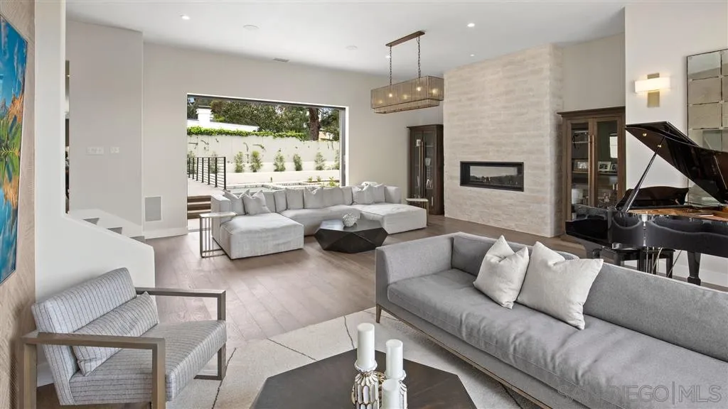 1631 Marisma Way La Jolla, CA 92037 - Photo 21 of 25 a living room with furniture and a flat screen tv