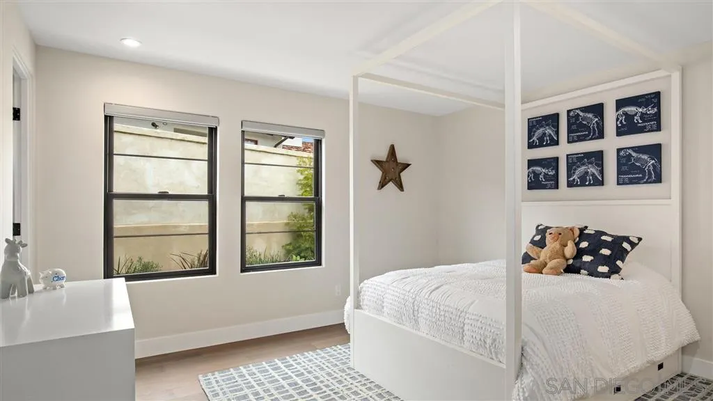 1631 Marisma Way La Jolla, CA 92037 - Photo 25 of 25 a bedroom with a bed and a window