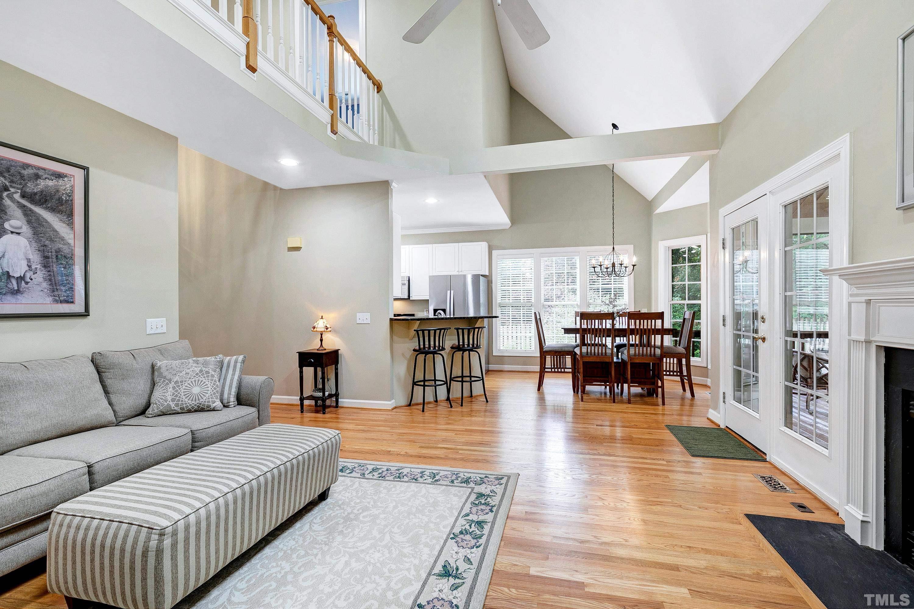 909 Cedar Downs Drive Raleigh, NC 27607 - Photo 13 of 32 a living room with furniture and wooden floor