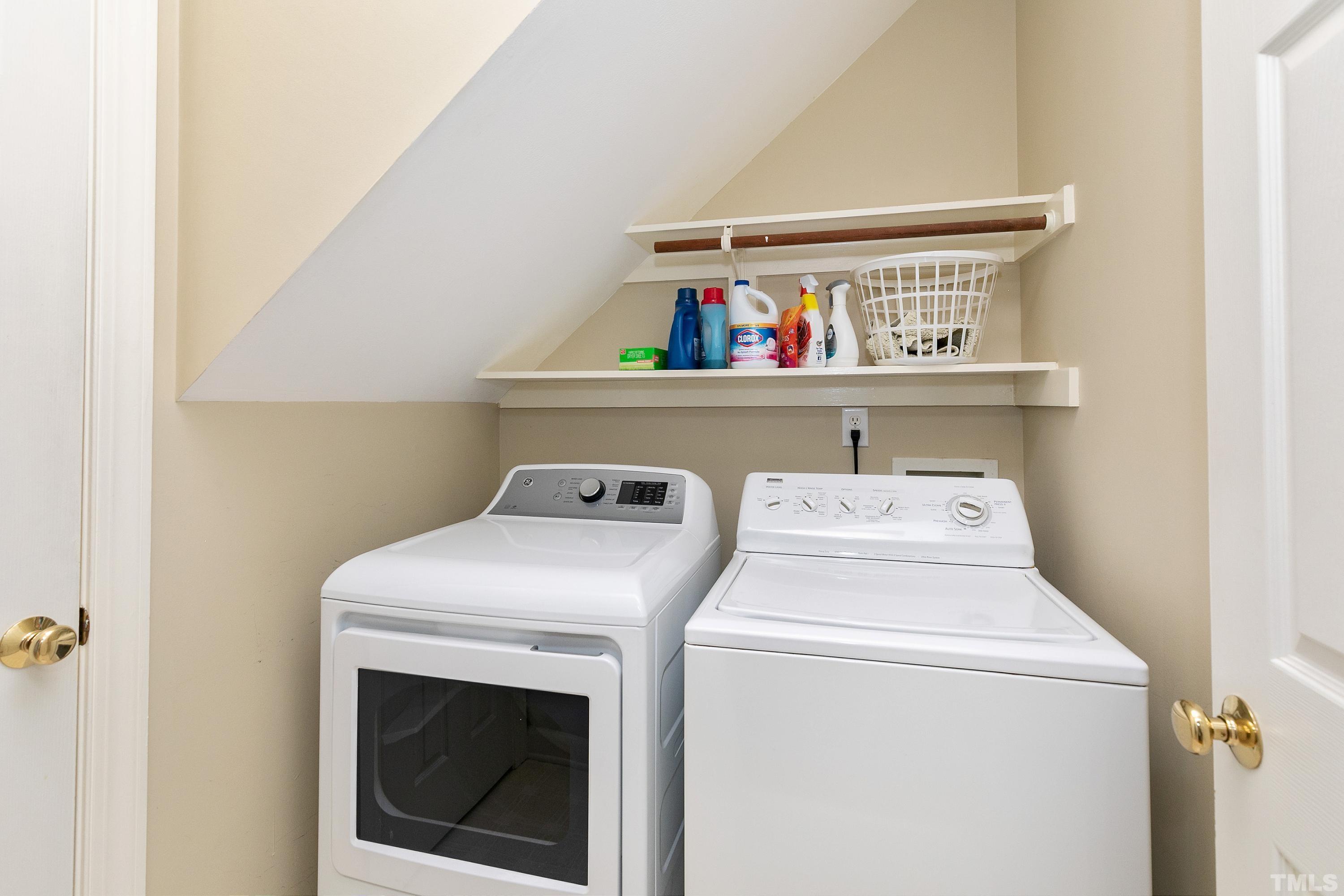 909 Cedar Downs Drive Raleigh, NC 27607 - Photo 15 of 32 a utility room with dryer and washer