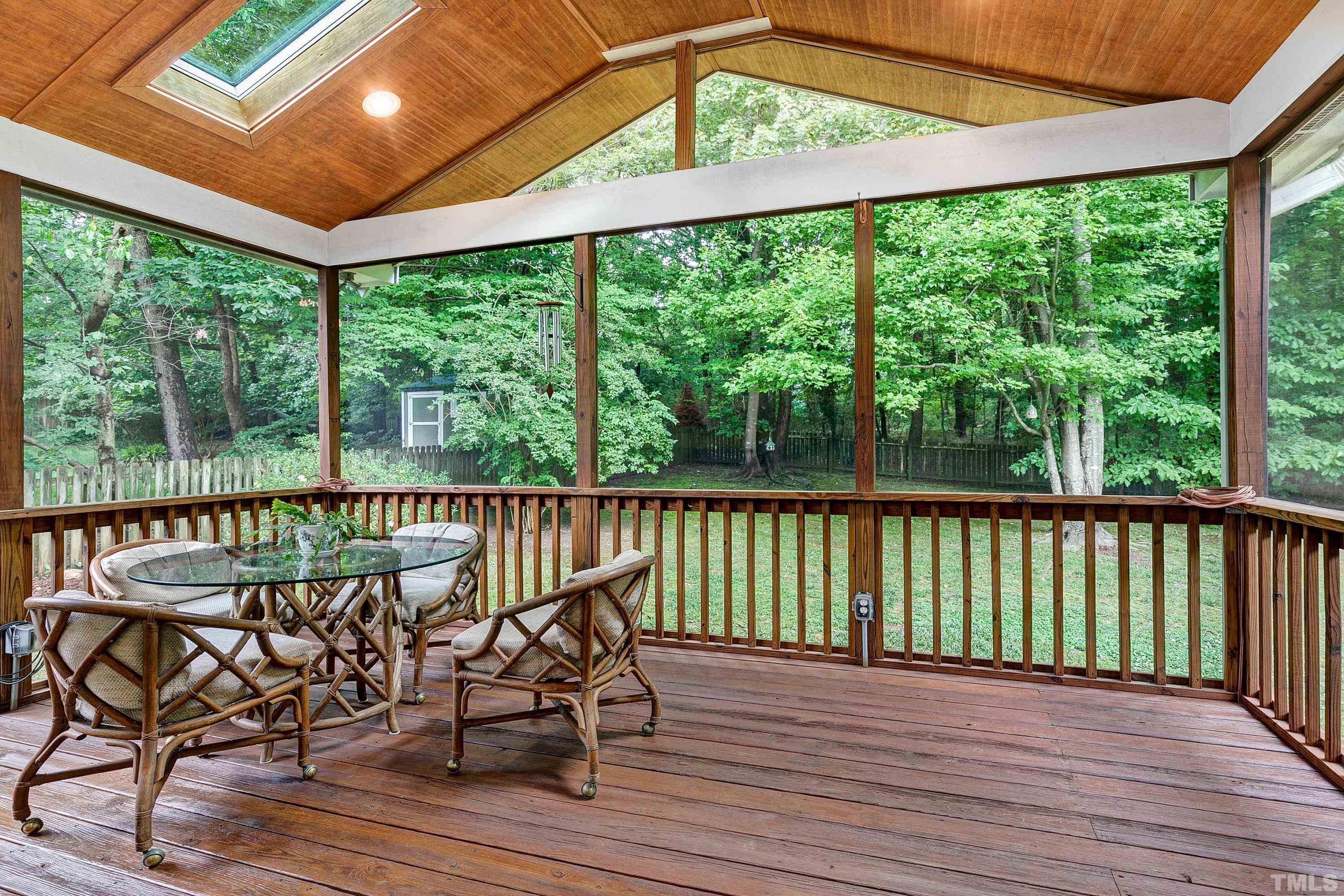 909 Cedar Downs Drive Raleigh, NC 27607 - Photo 16 of 32 a view of a balcony with furniture and wooden floor