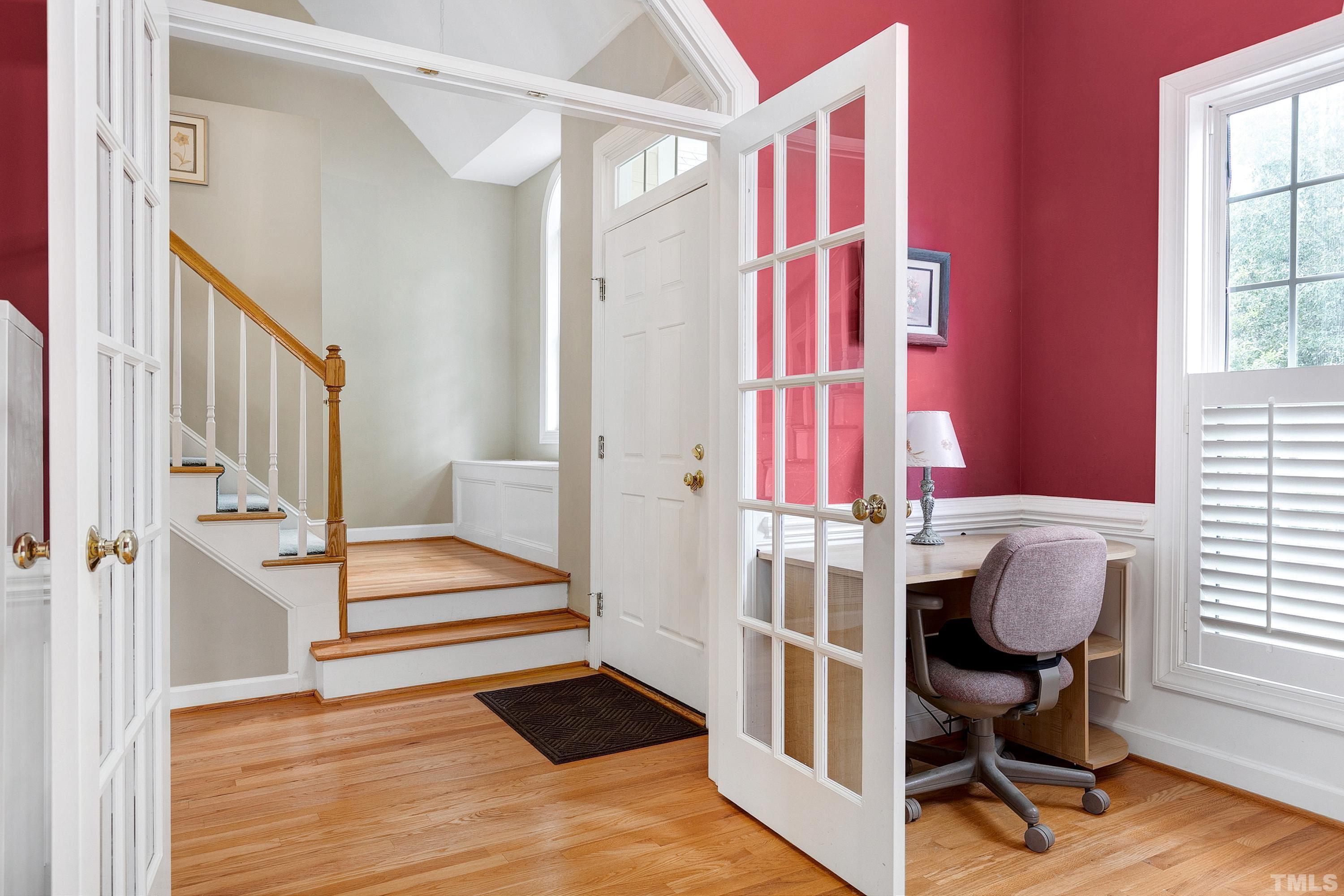 909 Cedar Downs Drive Raleigh, NC 27607 - Photo 17 of 32 a view of a bedroom with wooden floor and windows