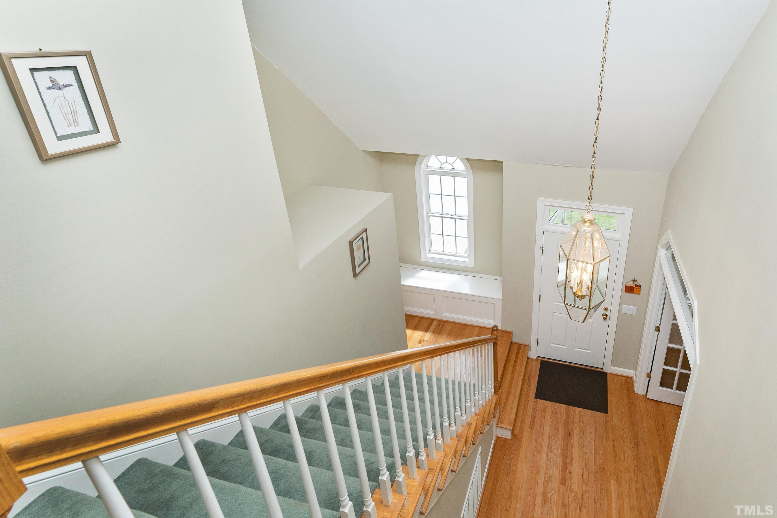 909 Cedar Downs Drive Raleigh, NC 27607 - Photo 18 of 32 a view of entryway with wooden floor