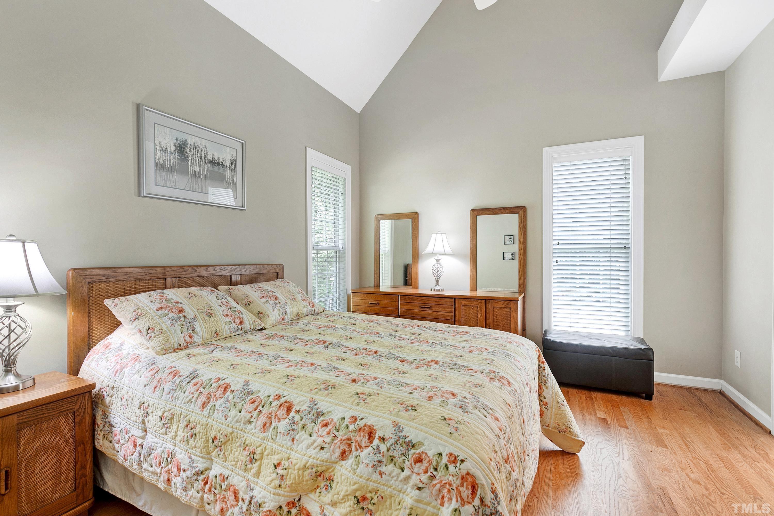 909 Cedar Downs Drive Raleigh, NC 27607 - Photo 19 of 32 a bedroom with a bed and a window