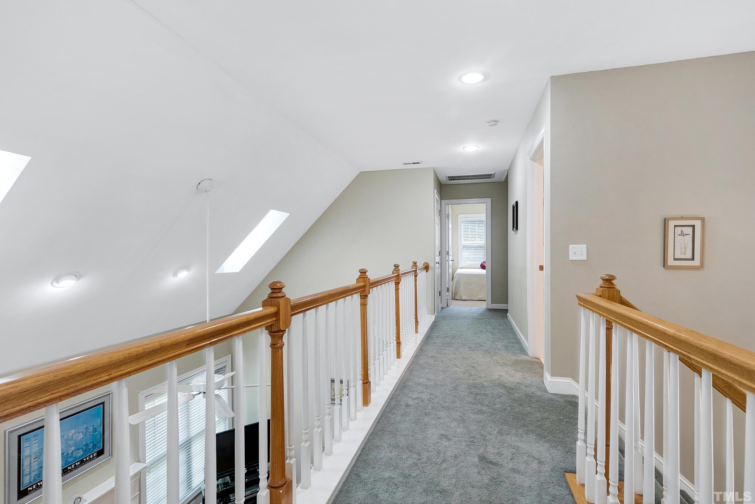 909 Cedar Downs Drive Raleigh, NC 27607 - Photo 24 of 32 a view of a hallway with stairs