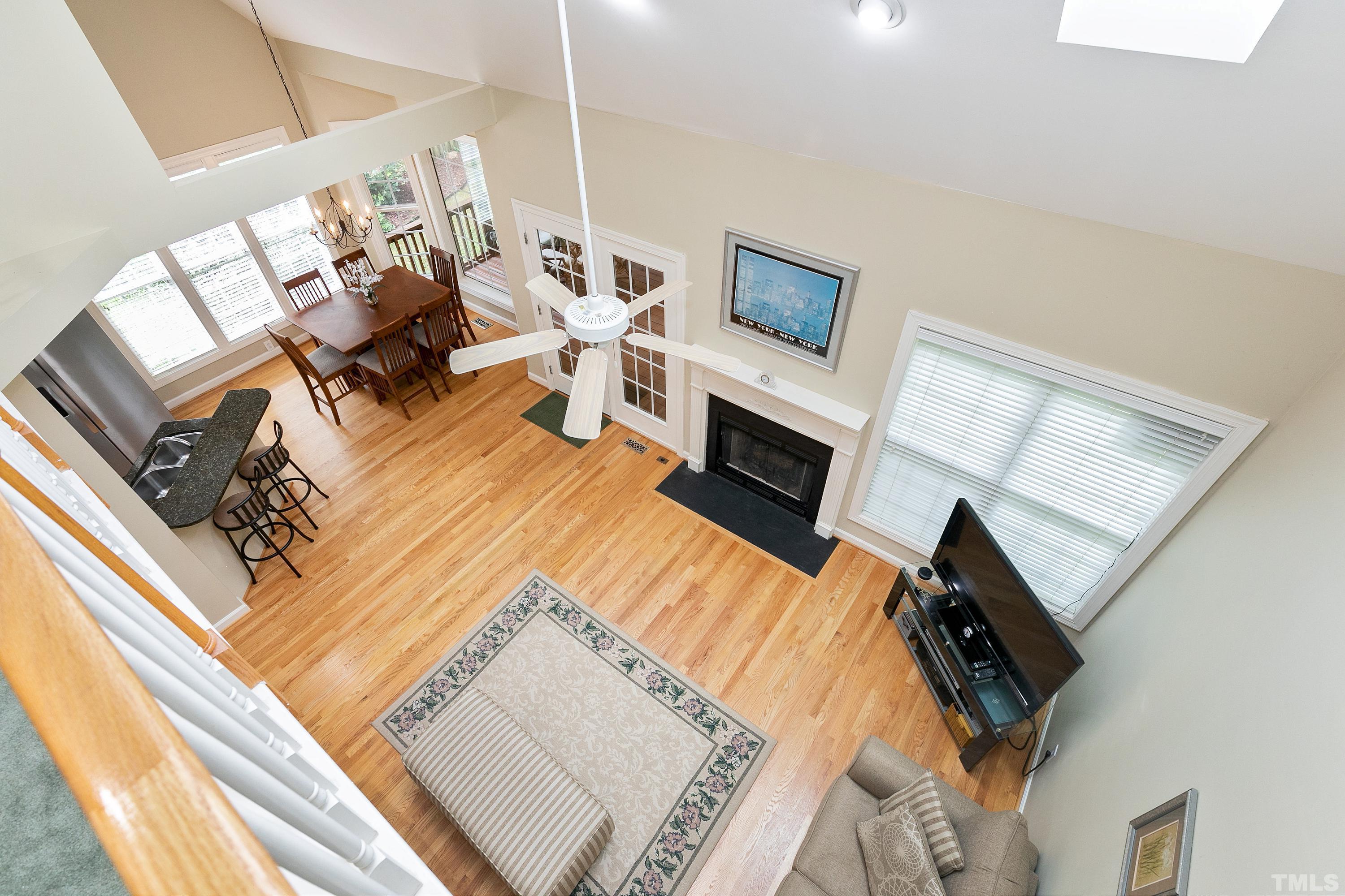 909 Cedar Downs Drive Raleigh, NC 27607 - Photo 25 of 32 a living room with furniture fireplace and flat screen tv