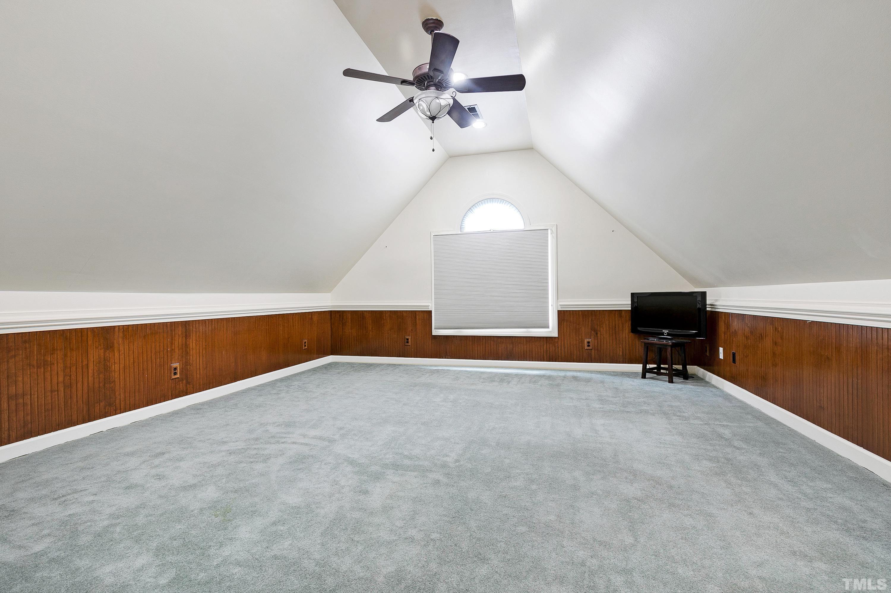909 Cedar Downs Drive Raleigh, NC 27607 - Photo 27 of 32 a view of an empty room with a window