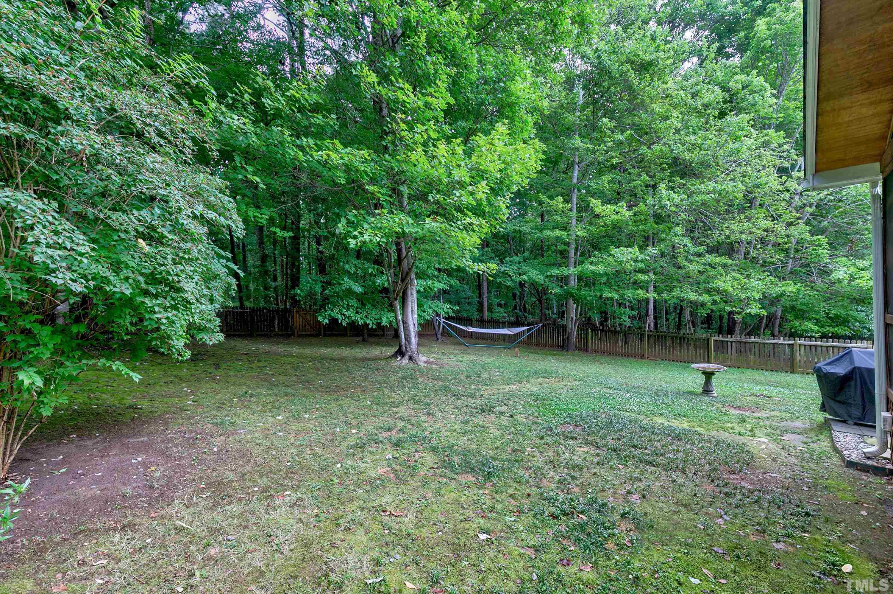 909 Cedar Downs Drive Raleigh, NC 27607 - Photo 30 of 32 a view of outdoor space with deck and yard