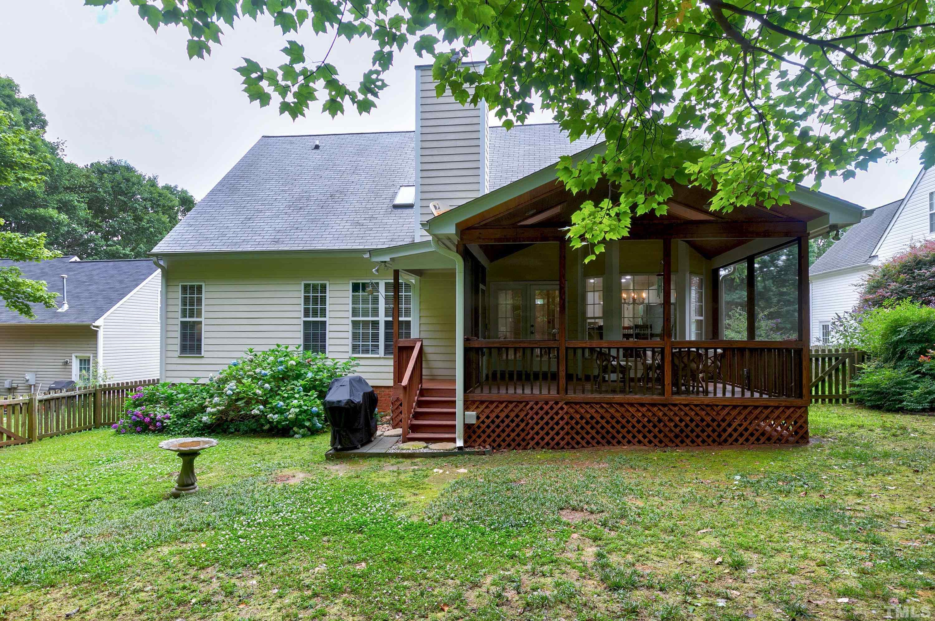 909 Cedar Downs Drive Raleigh, NC 27607 - Photo 32 of 32 front view of a house with a yard