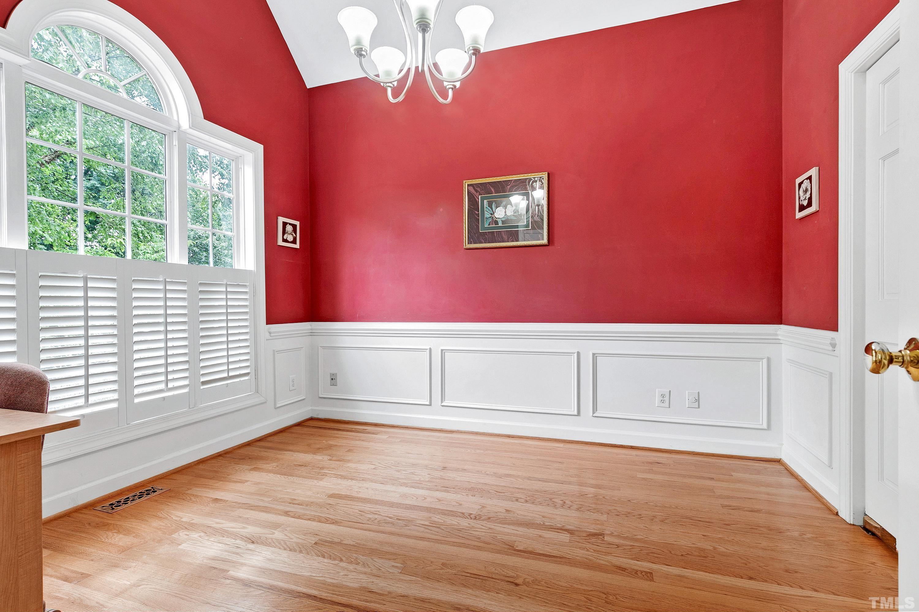909 Cedar Downs Drive Raleigh, NC 27607 - Photo 6 of 32 a view of empty room with wooden floor