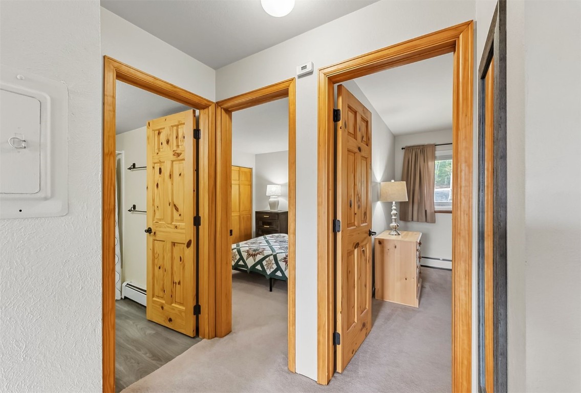 9849 Ryan Gulch Road, Unit 203 Silverthorne, CO 80498 - Photo 19 of 35 a view of a bathroom with tub and mirror