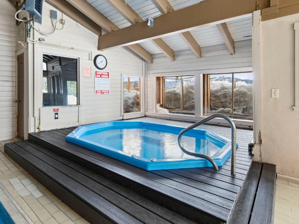 9849 Ryan Gulch Road, Unit 203 Silverthorne, CO 80498 - Photo 34 of 35 a living room with wooden floor