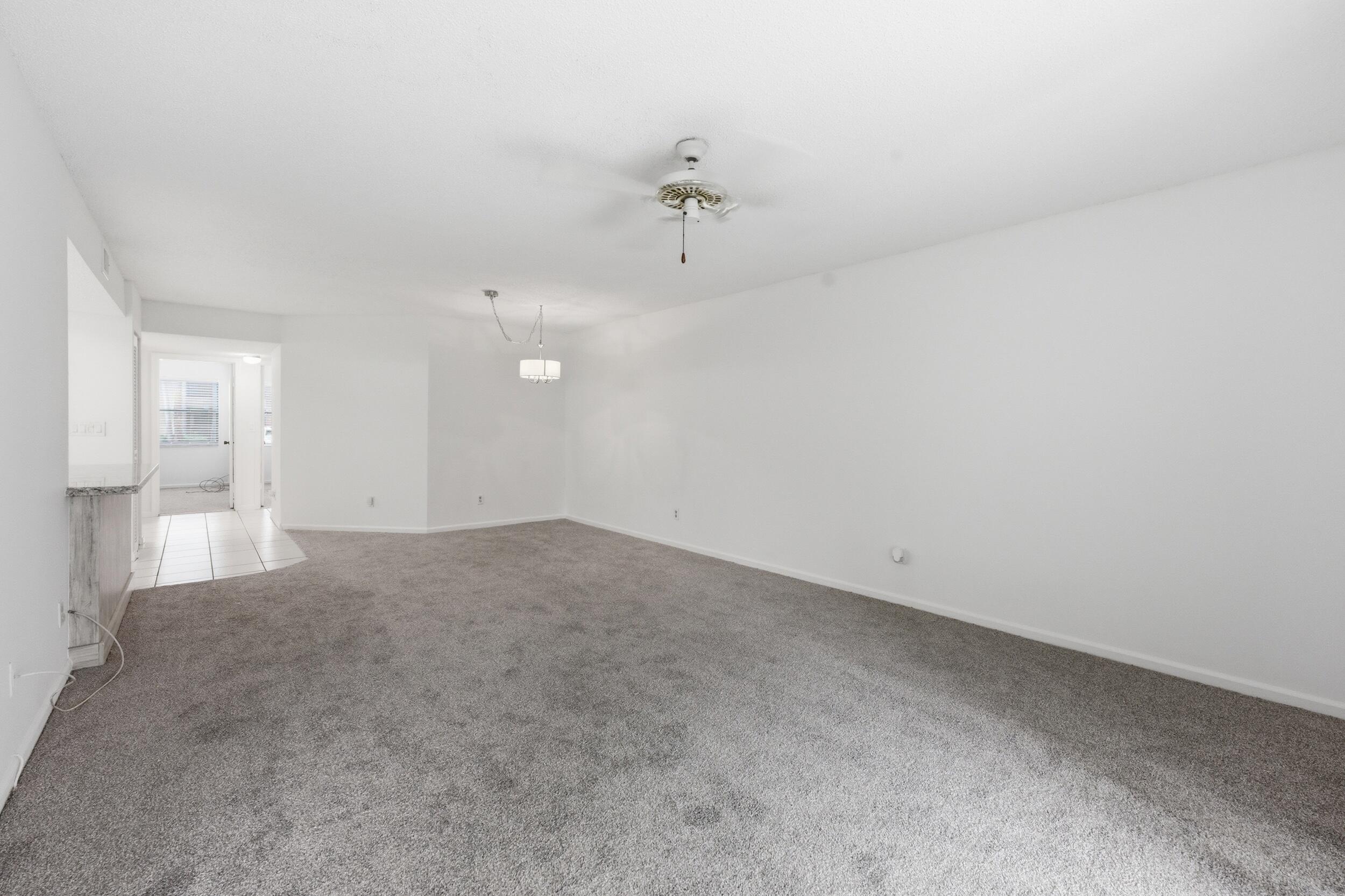 9633 Riverside Drive, Unit E3 Coral Springs, FL 33071 - Photo 11 of 31 a view of a big room with closet and windows