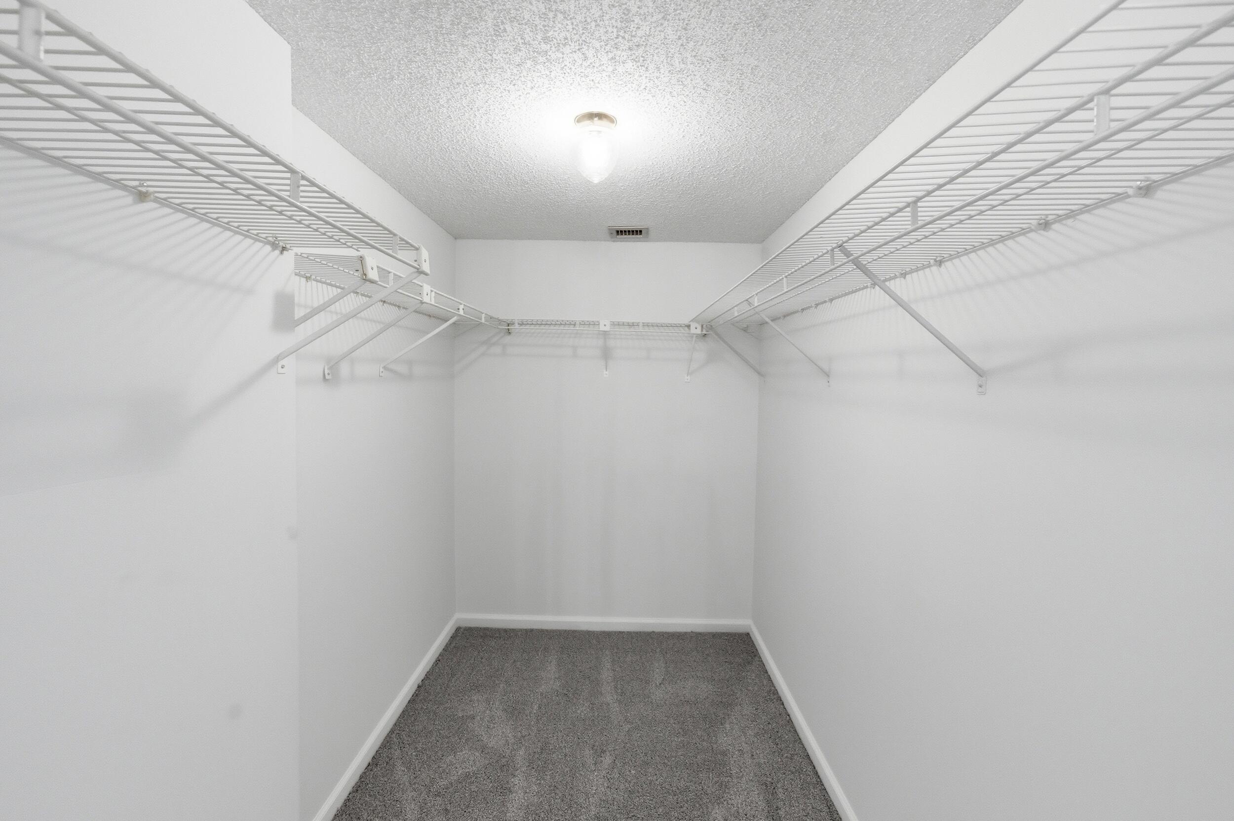 9633 Riverside Drive, Unit E3 Coral Springs, FL 33071 - Photo 13 of 31 a view of a room with racks on the wall
