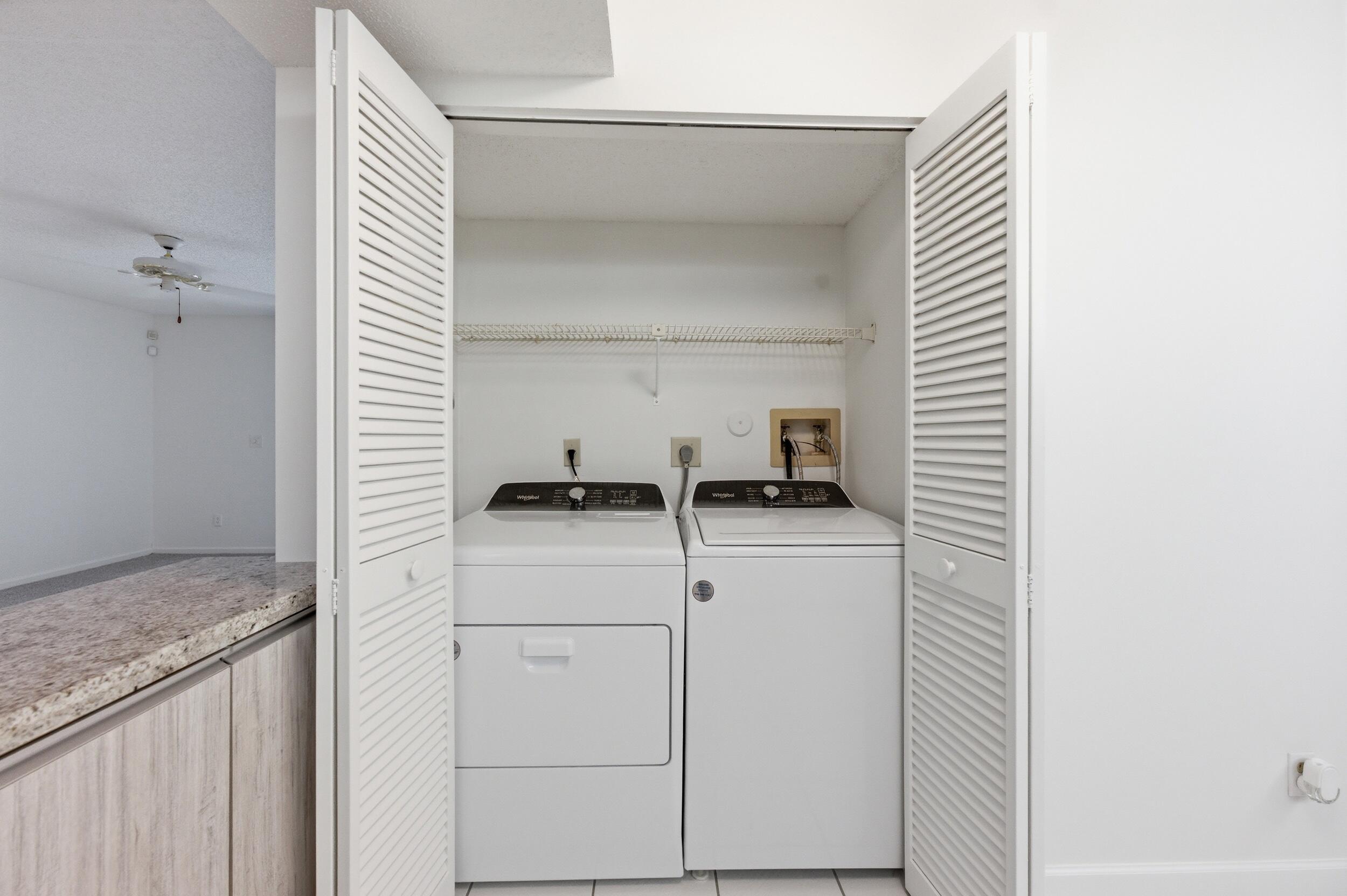 9633 Riverside Drive, Unit E3 Coral Springs, FL 33071 - Photo 24 of 31 a kitchen with a sink and a stove