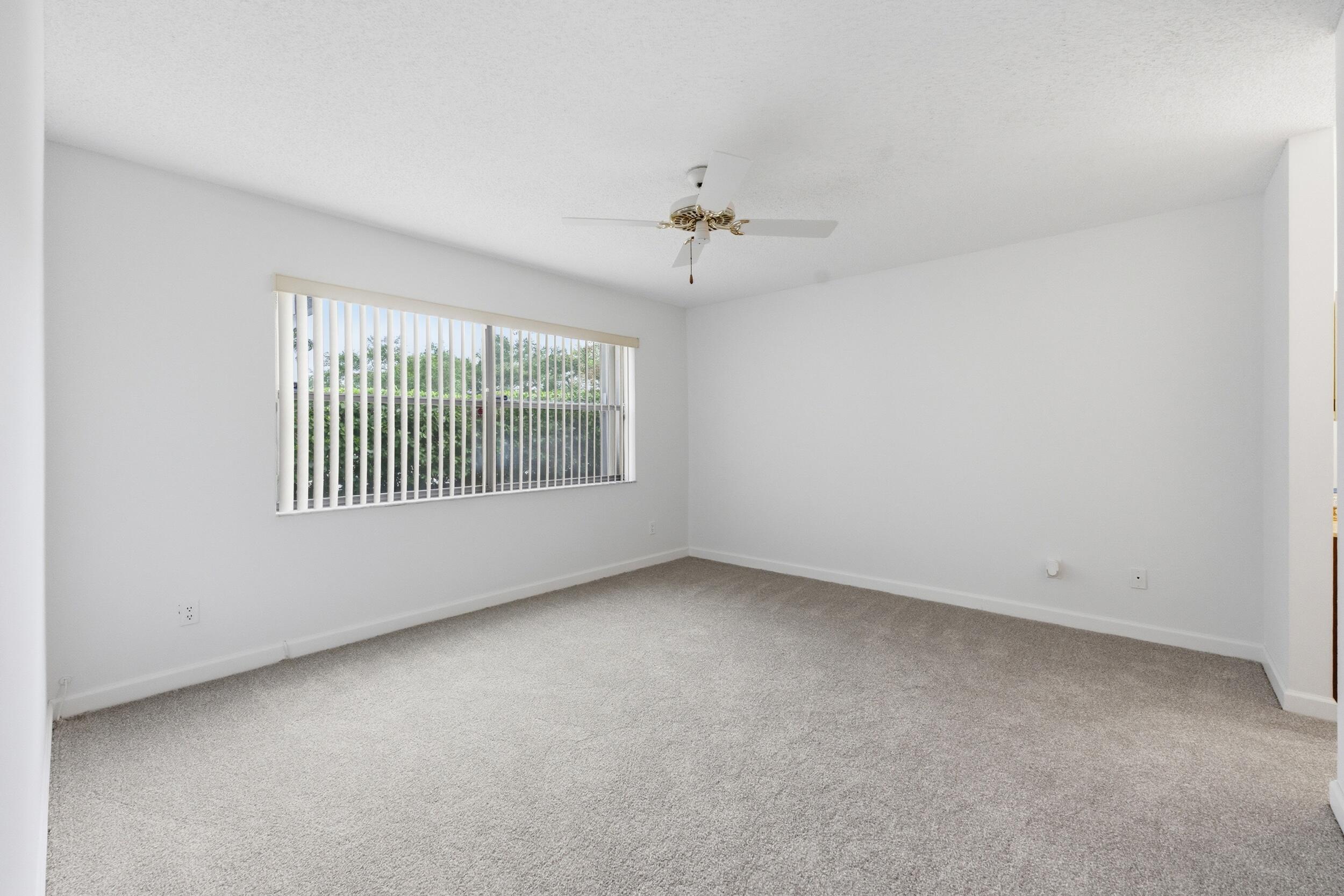9633 Riverside Drive, Unit E3 Coral Springs, FL 33071 - Photo 26 of 31 an empty room with windows