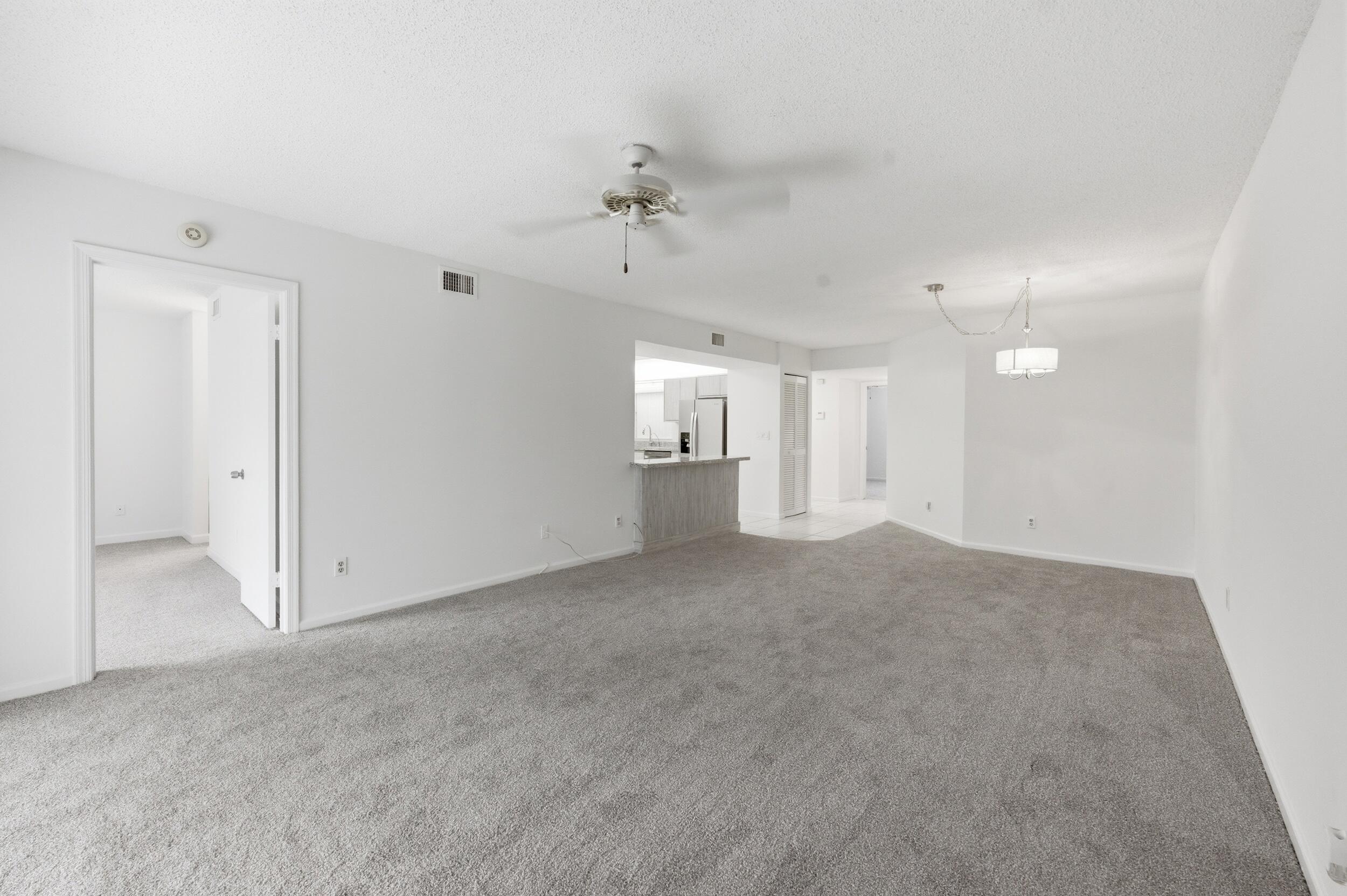 9633 Riverside Drive, Unit E3 Coral Springs, FL 33071 - Photo 27 of 31 wooden floor in an empty room