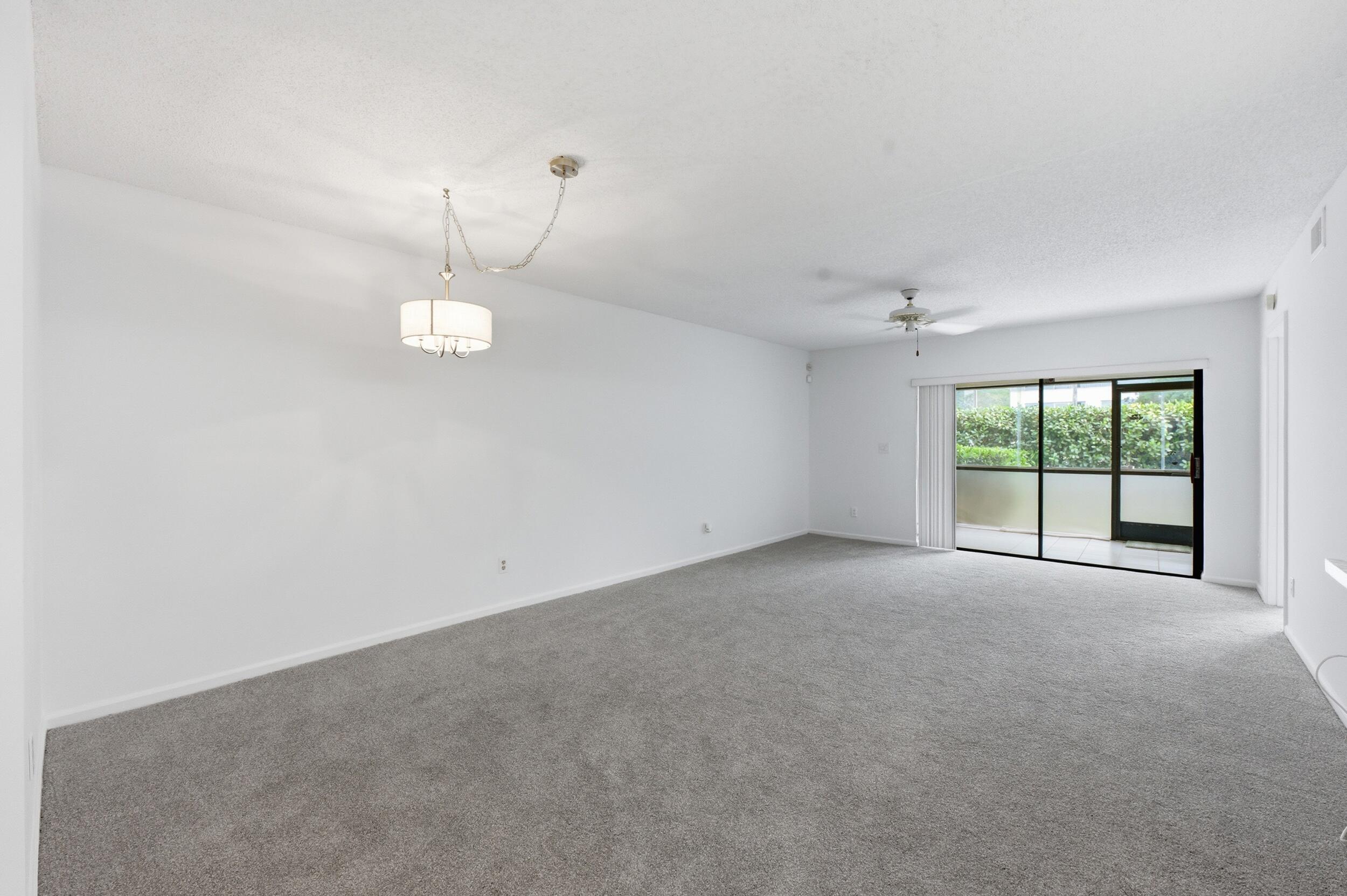 9633 Riverside Drive, Unit E3 Coral Springs, FL 33071 - Photo 28 of 31 a view of an empty room with a window