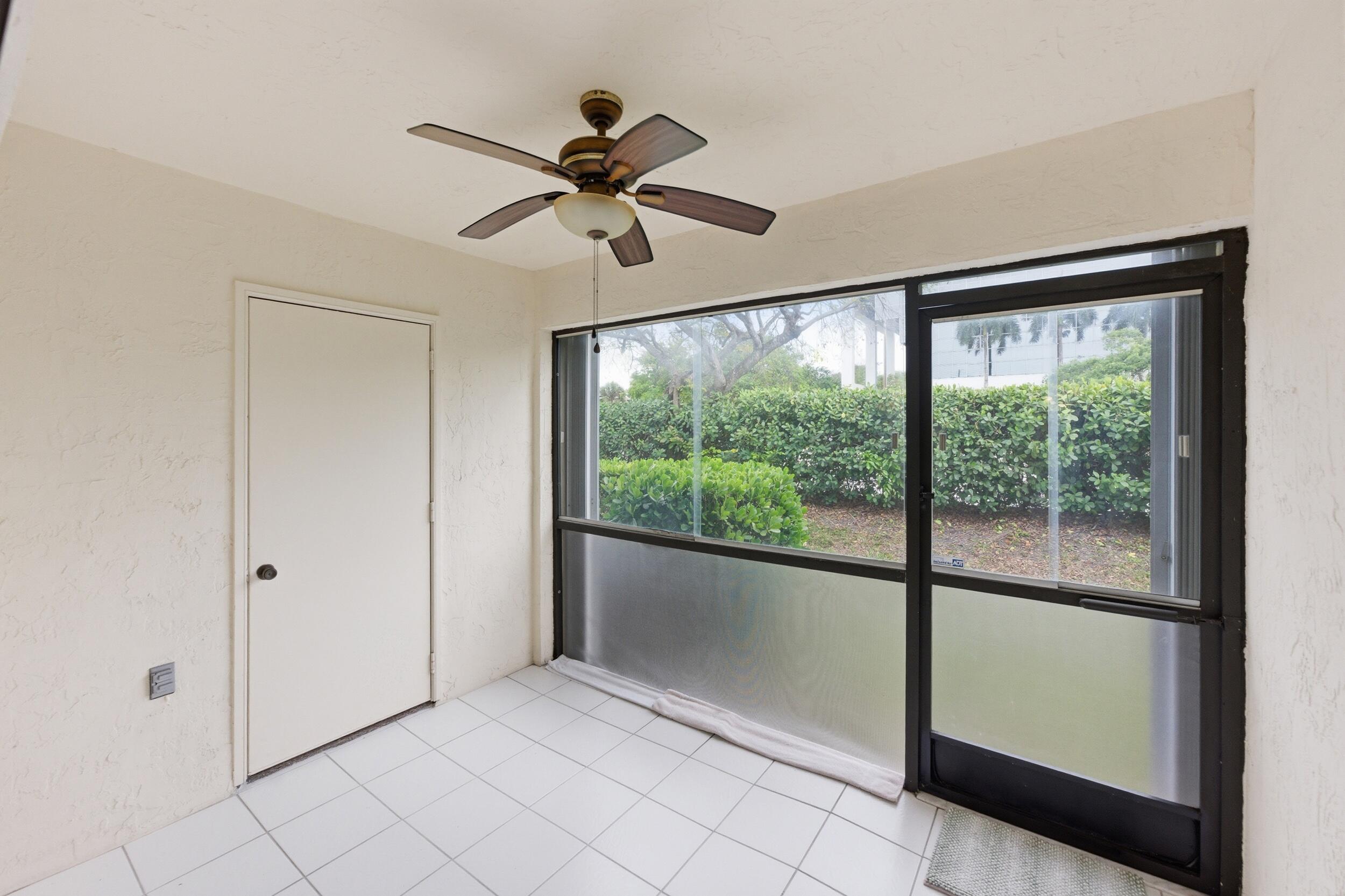 9633 Riverside Drive, Unit E3 Coral Springs, FL 33071 - Photo 29 of 31 a view of an empty room with a window