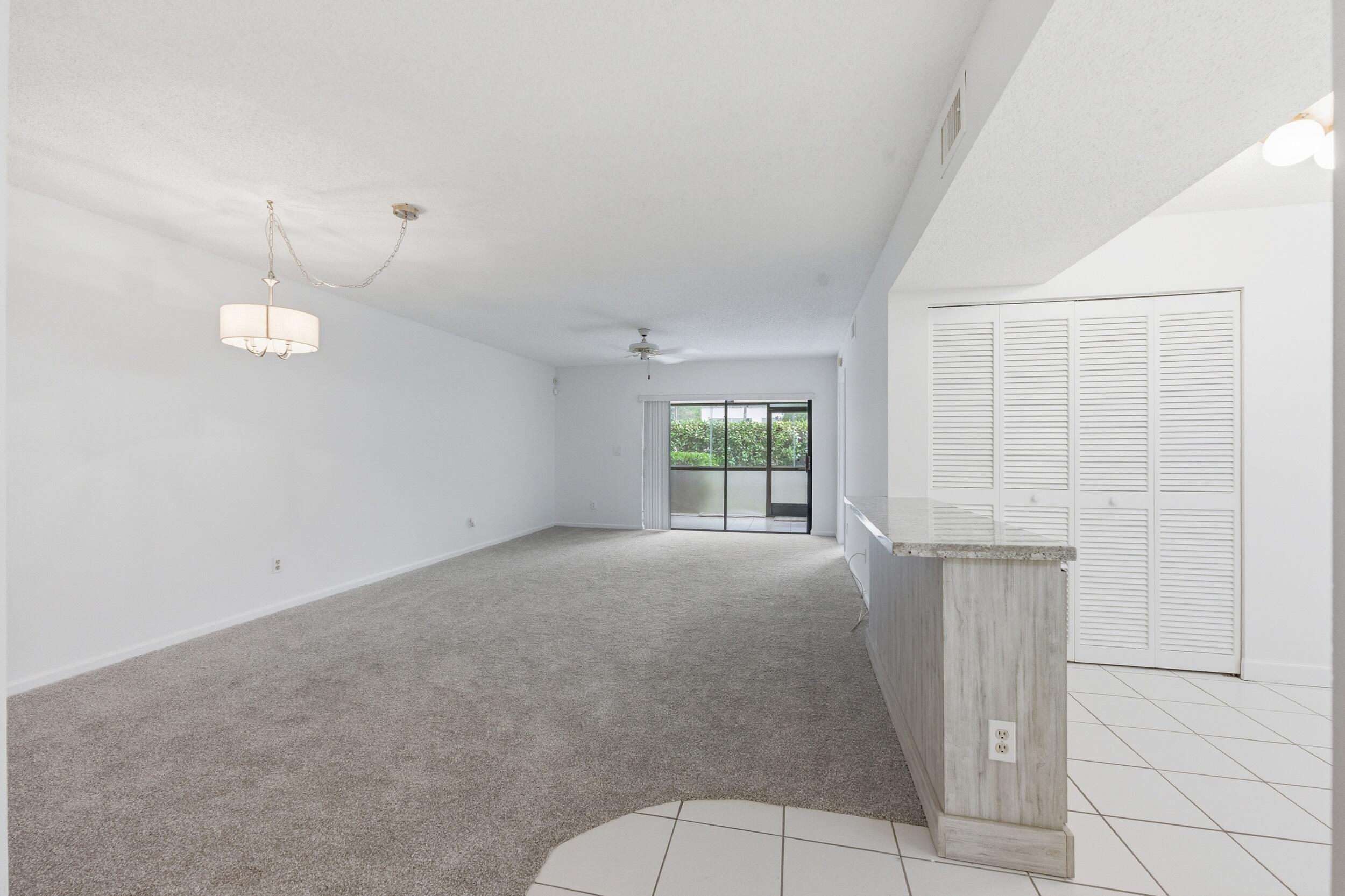 9633 Riverside Drive, Unit E3 Coral Springs, FL 33071 - Photo 10 of 31 a view of an empty room with a window