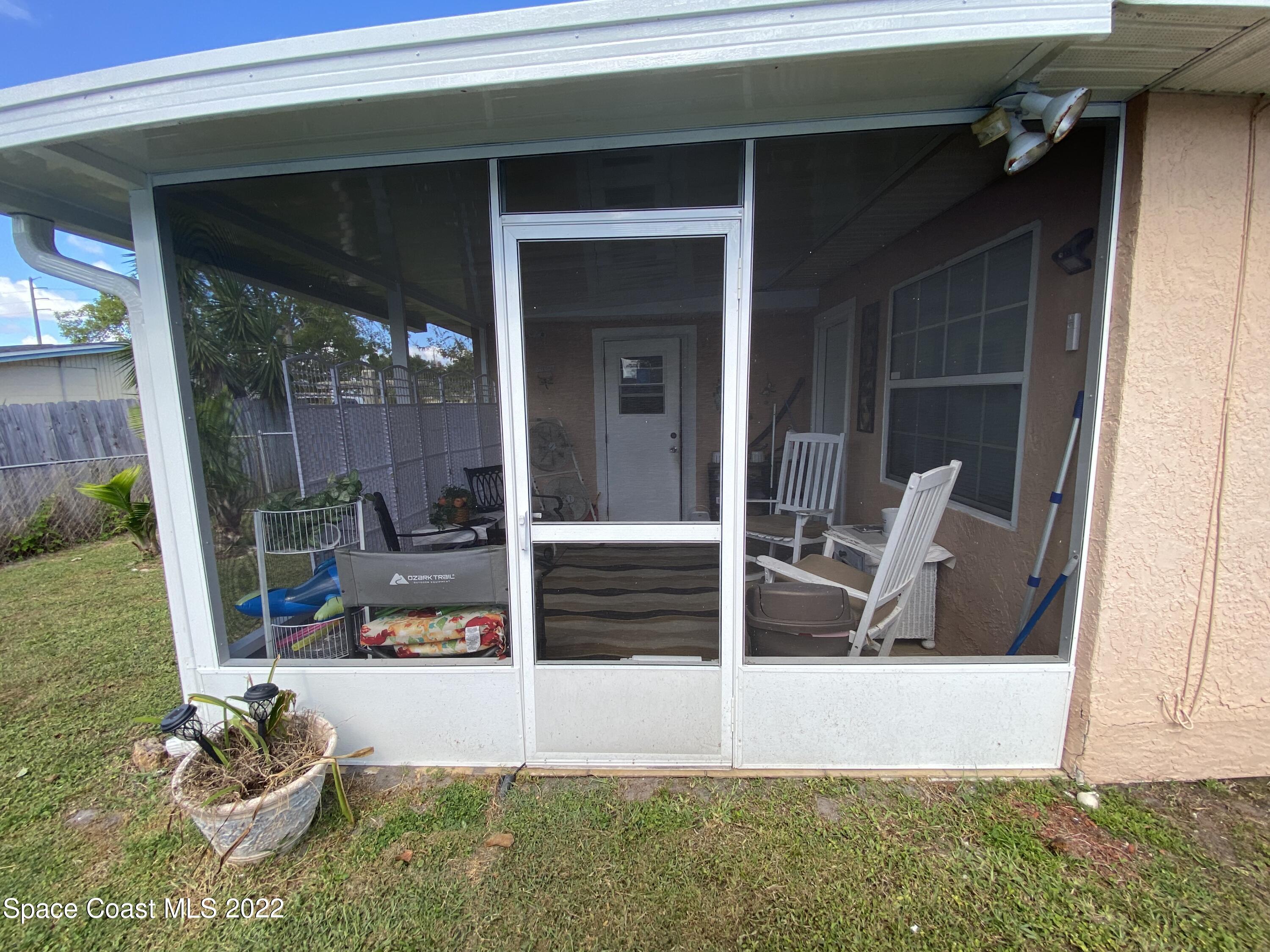 2807 Tropic Road Melbourne, FL 32935 - Photo 13 of 24 a view of living room and patio