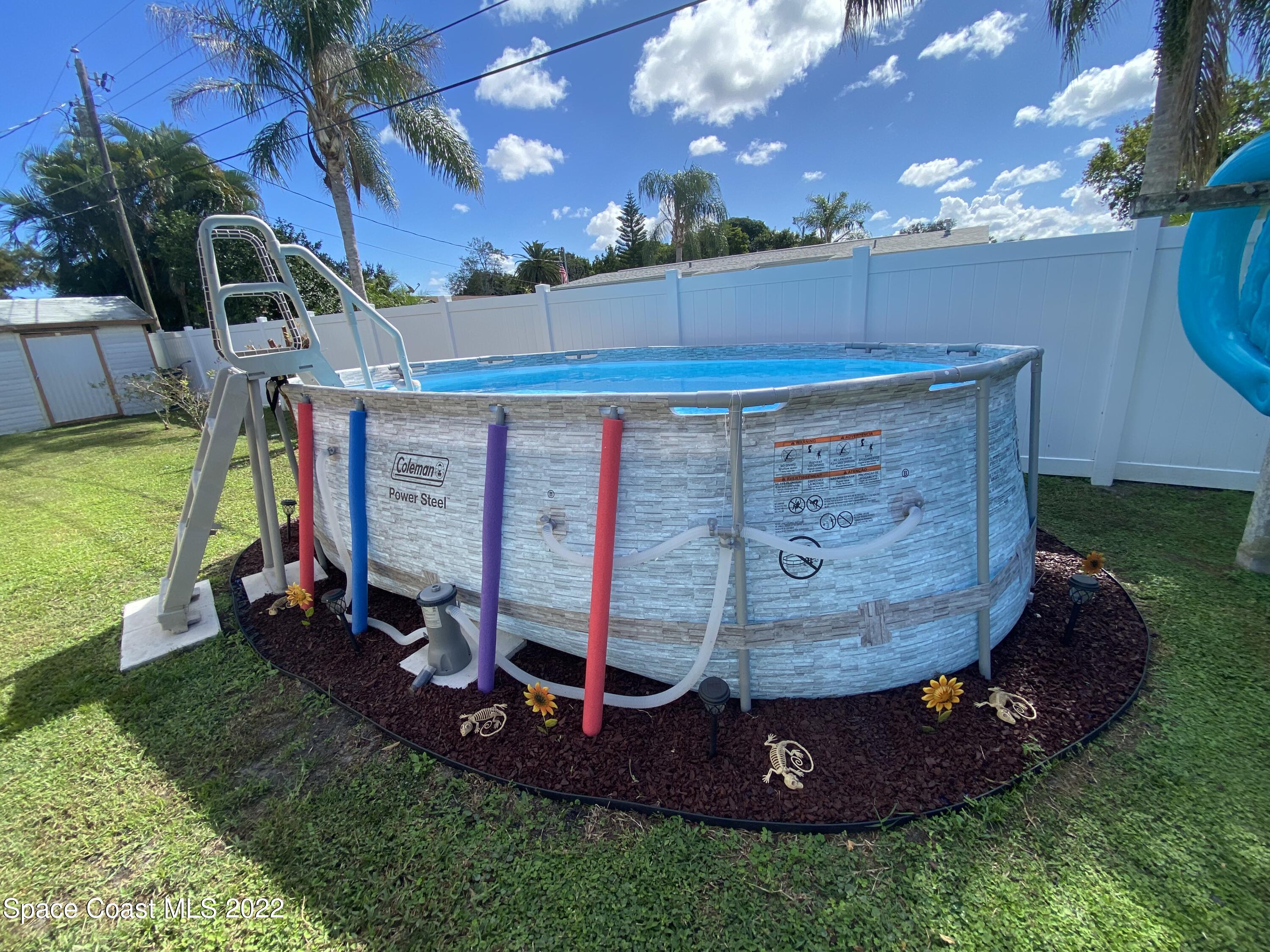 2807 Tropic Road Melbourne, FL 32935 - Photo 15 of 24 a view of a backyard with a barn