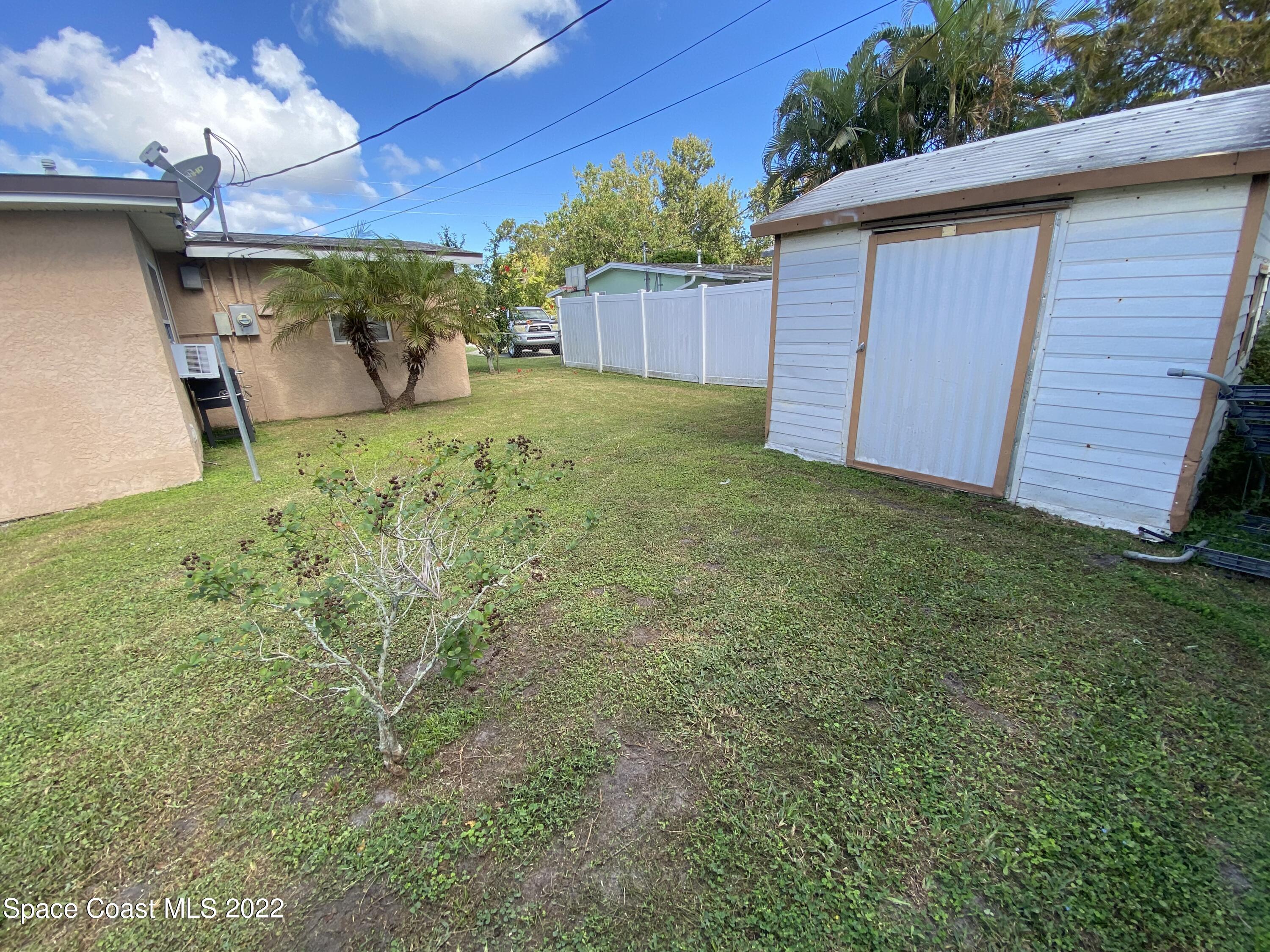 2807 Tropic Road Melbourne, FL 32935 - Photo 17 of 24 a view of a backyard
