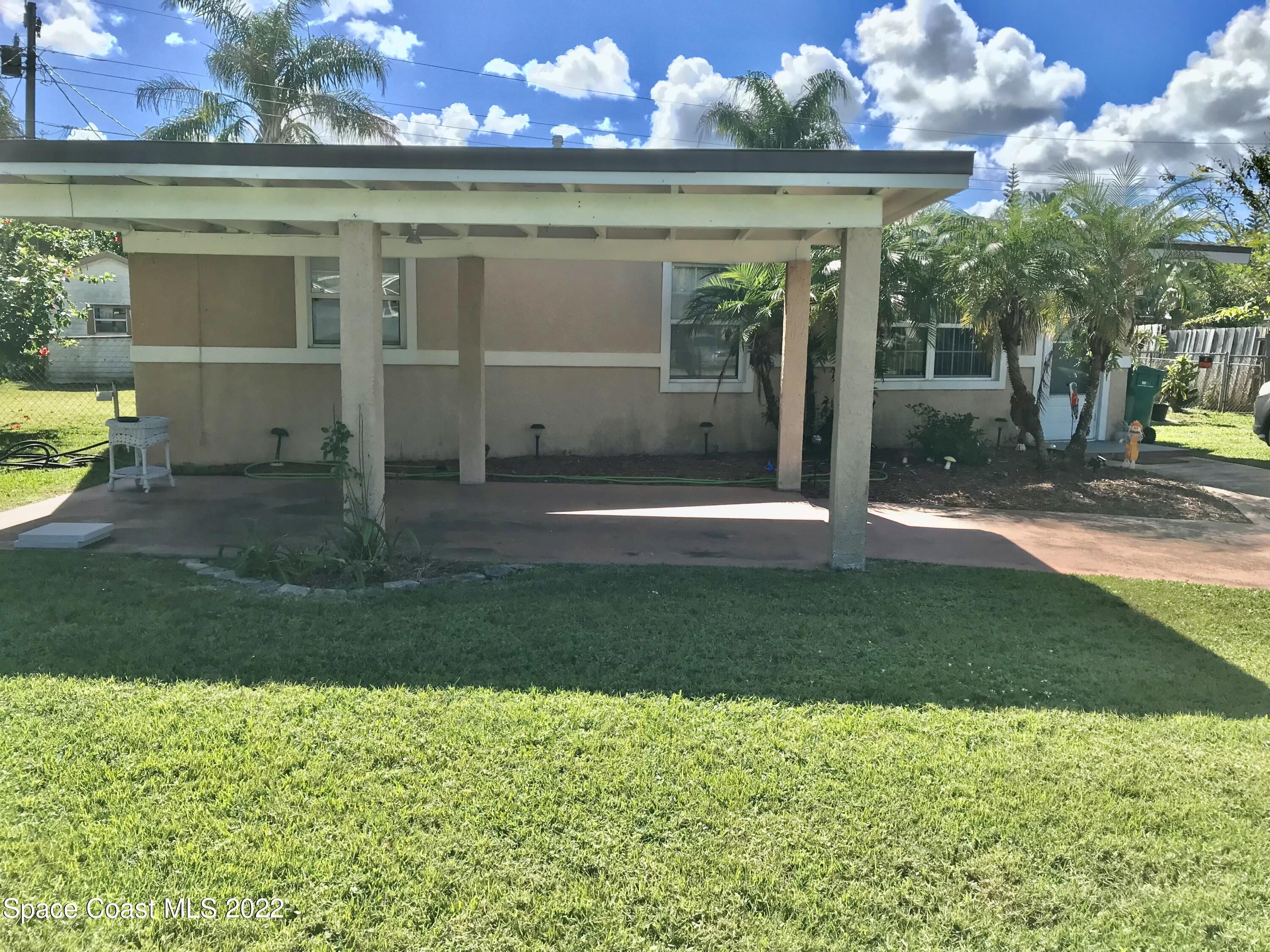 2807 Tropic Road Melbourne, FL 32935 - Photo 18 of 24 a view of a house with a yard
