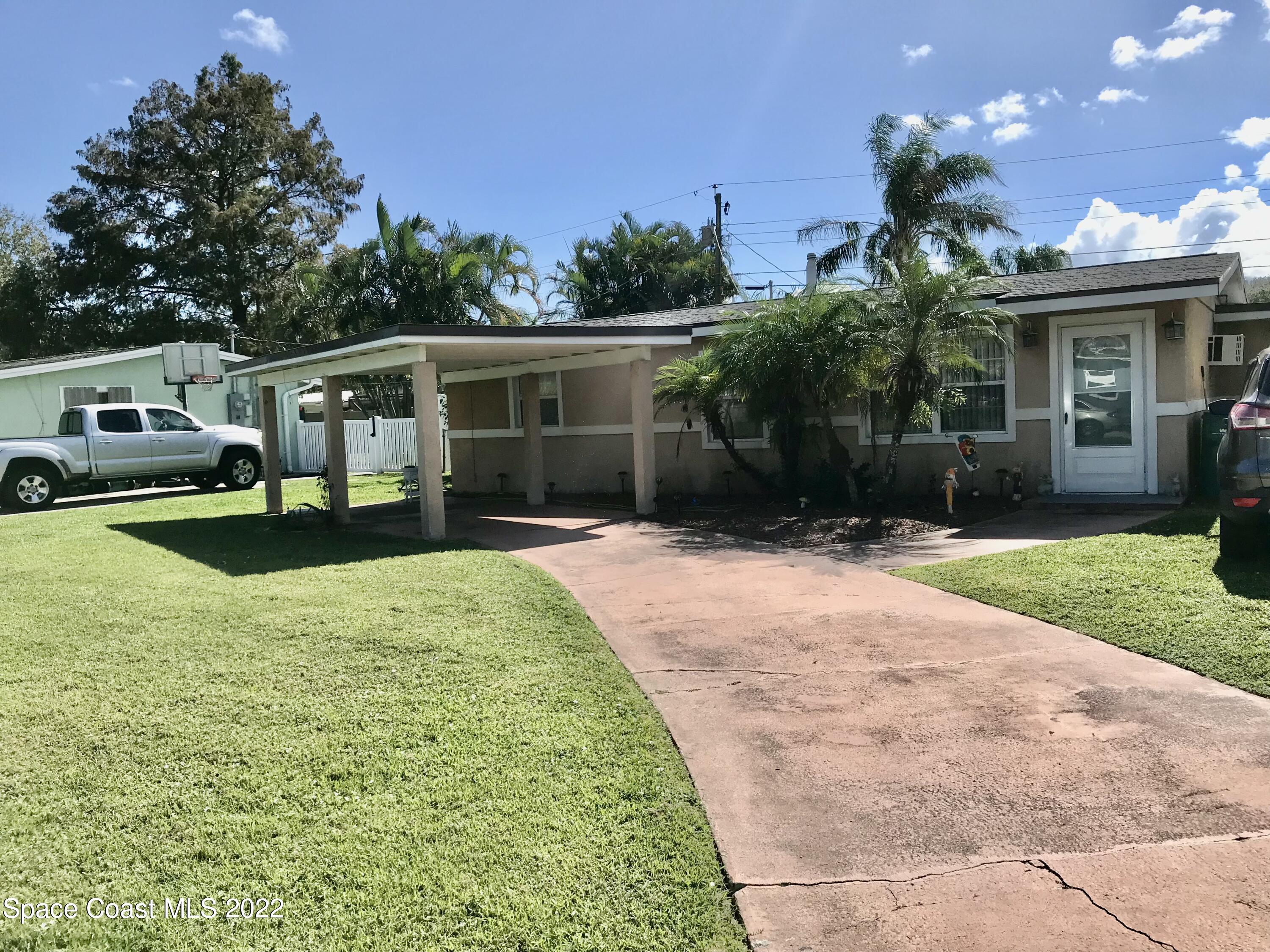 2807 Tropic Road Melbourne, FL 32935 - Photo 20 of 24 a view of a house with backyard and sitting area