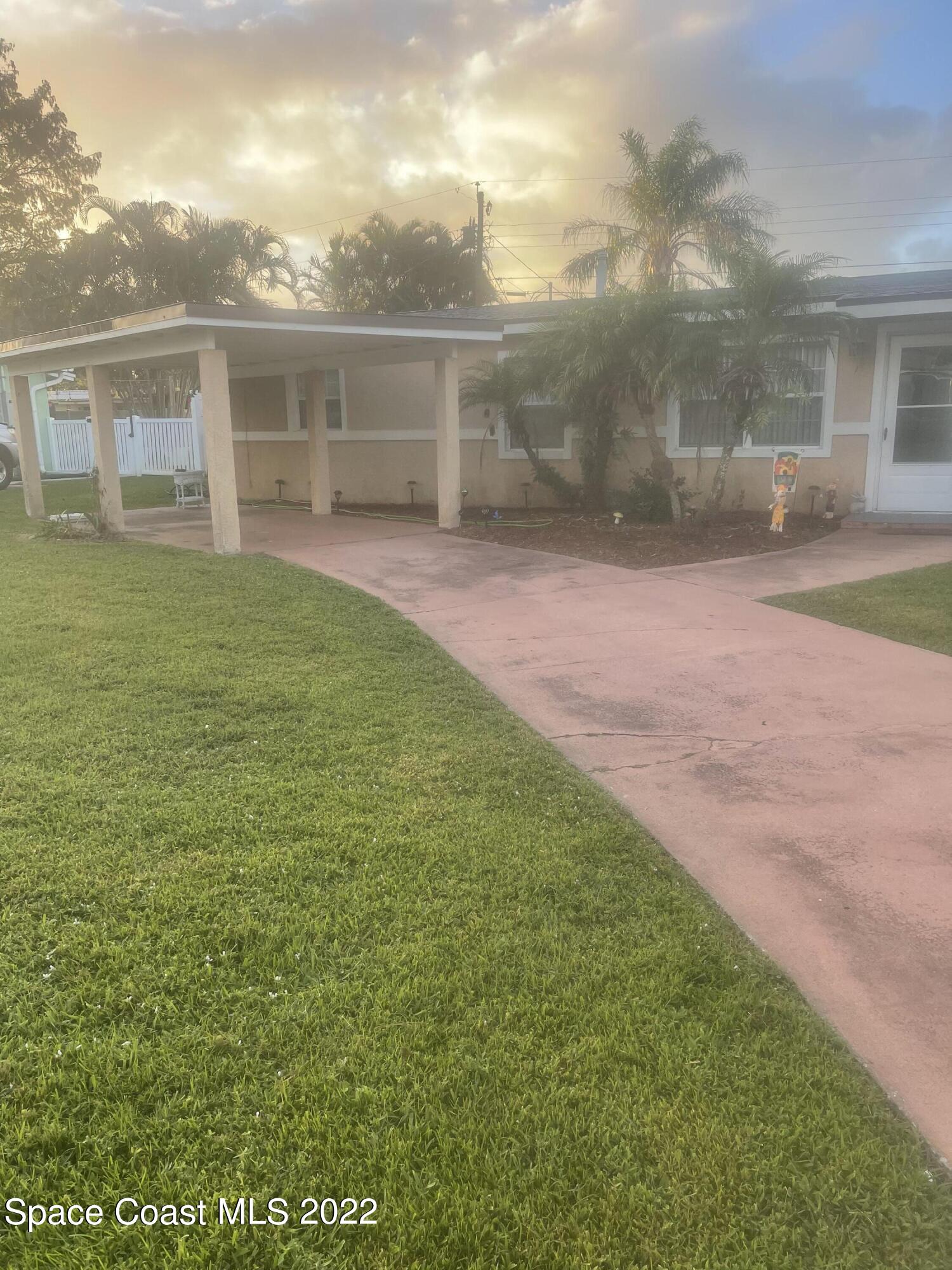 2807 Tropic Road Melbourne, FL 32935 - Photo 22 of 24 a view of a house with a yard
