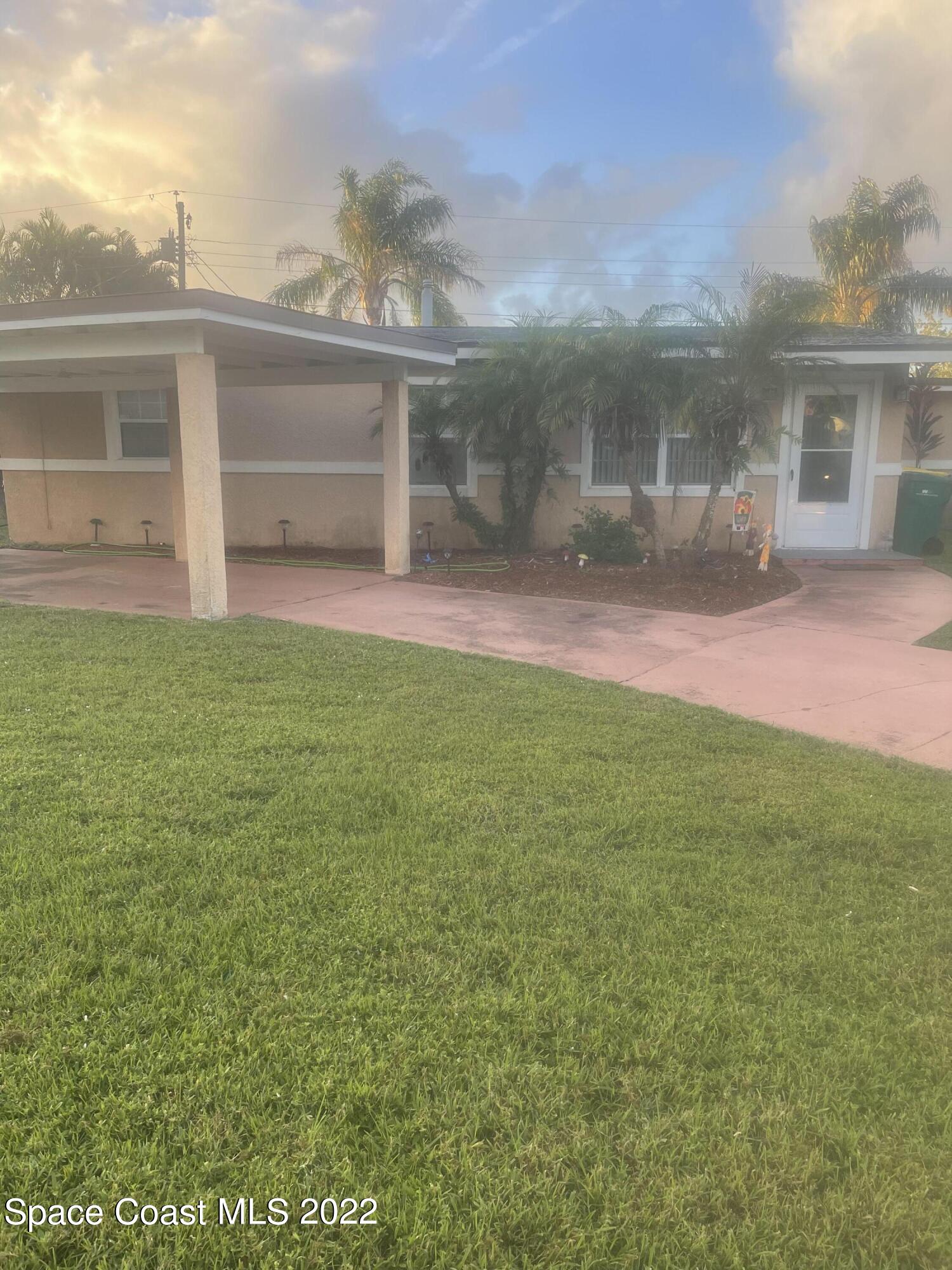 2807 Tropic Road Melbourne, FL 32935 - Photo 23 of 24 a view of a house with a backyard