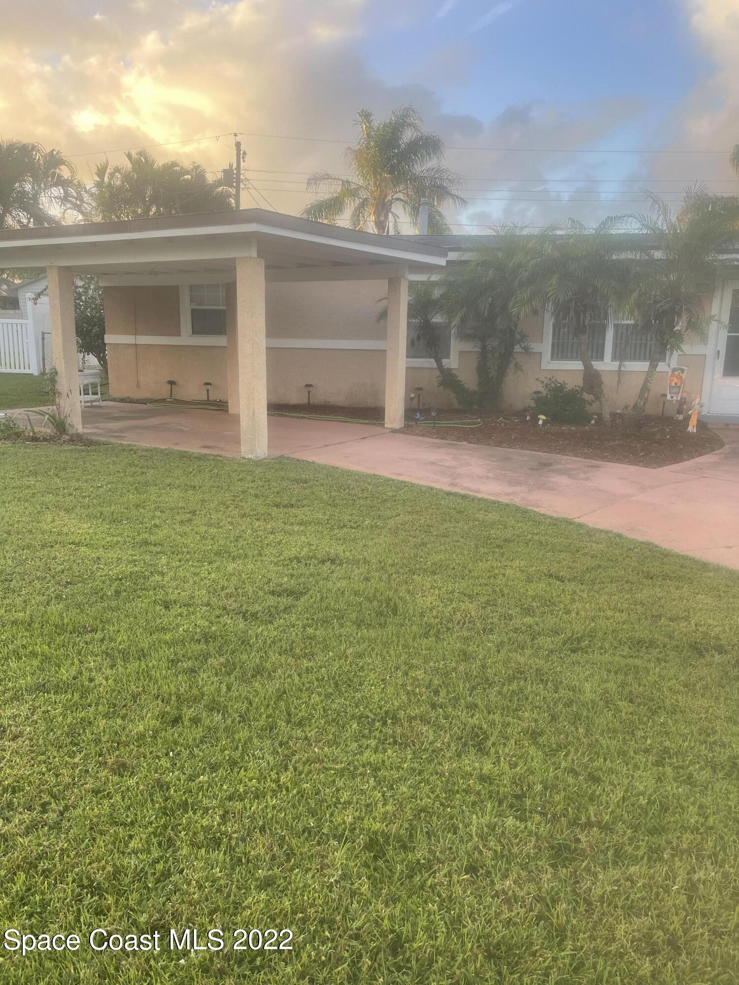 2807 Tropic Road Melbourne, FL 32935 - Photo 24 of 24 a view of a house with backyard and porch