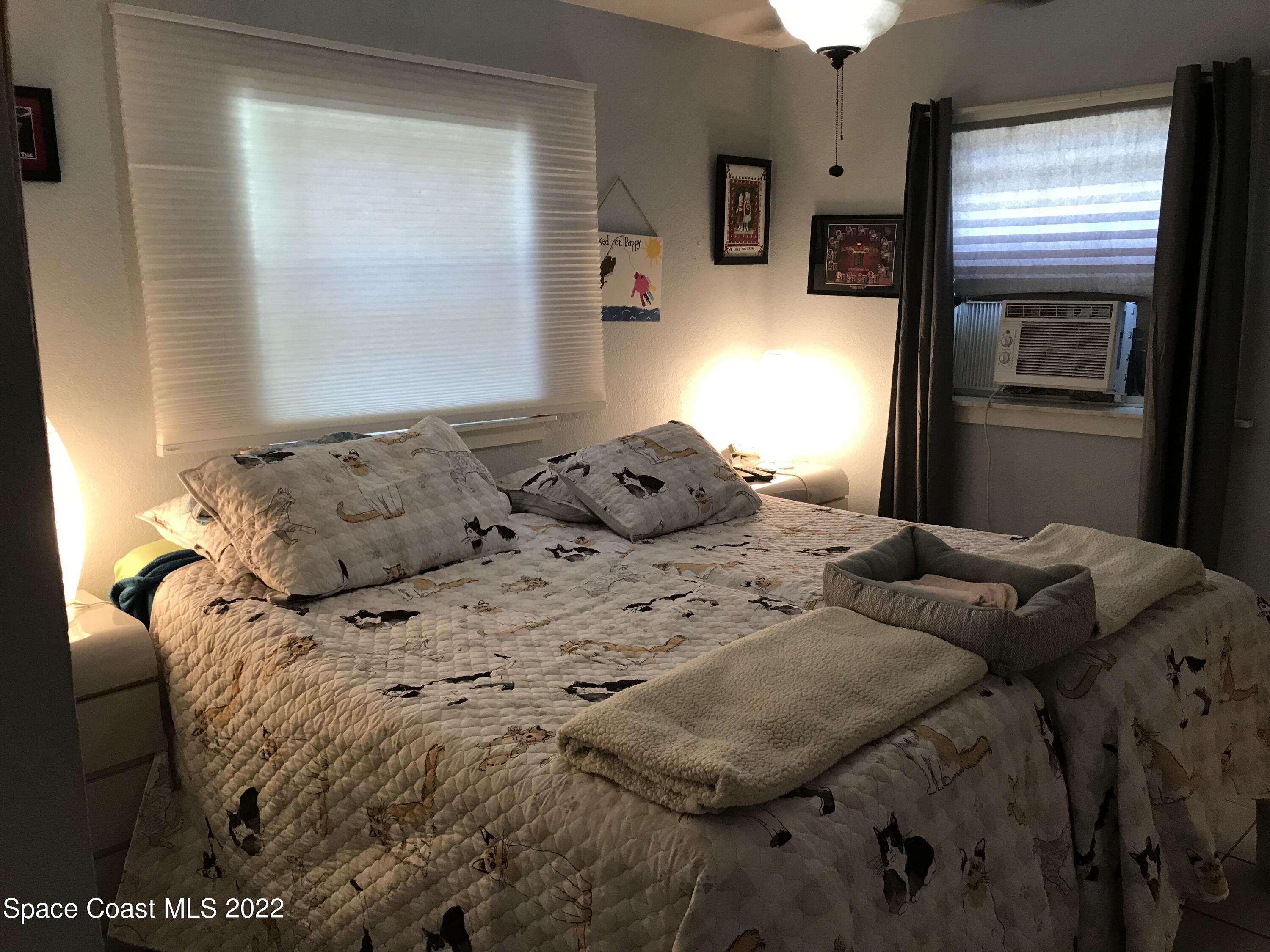 2807 Tropic Road Melbourne, FL 32935 - Photo 7 of 24 a bedroom with a bed and window