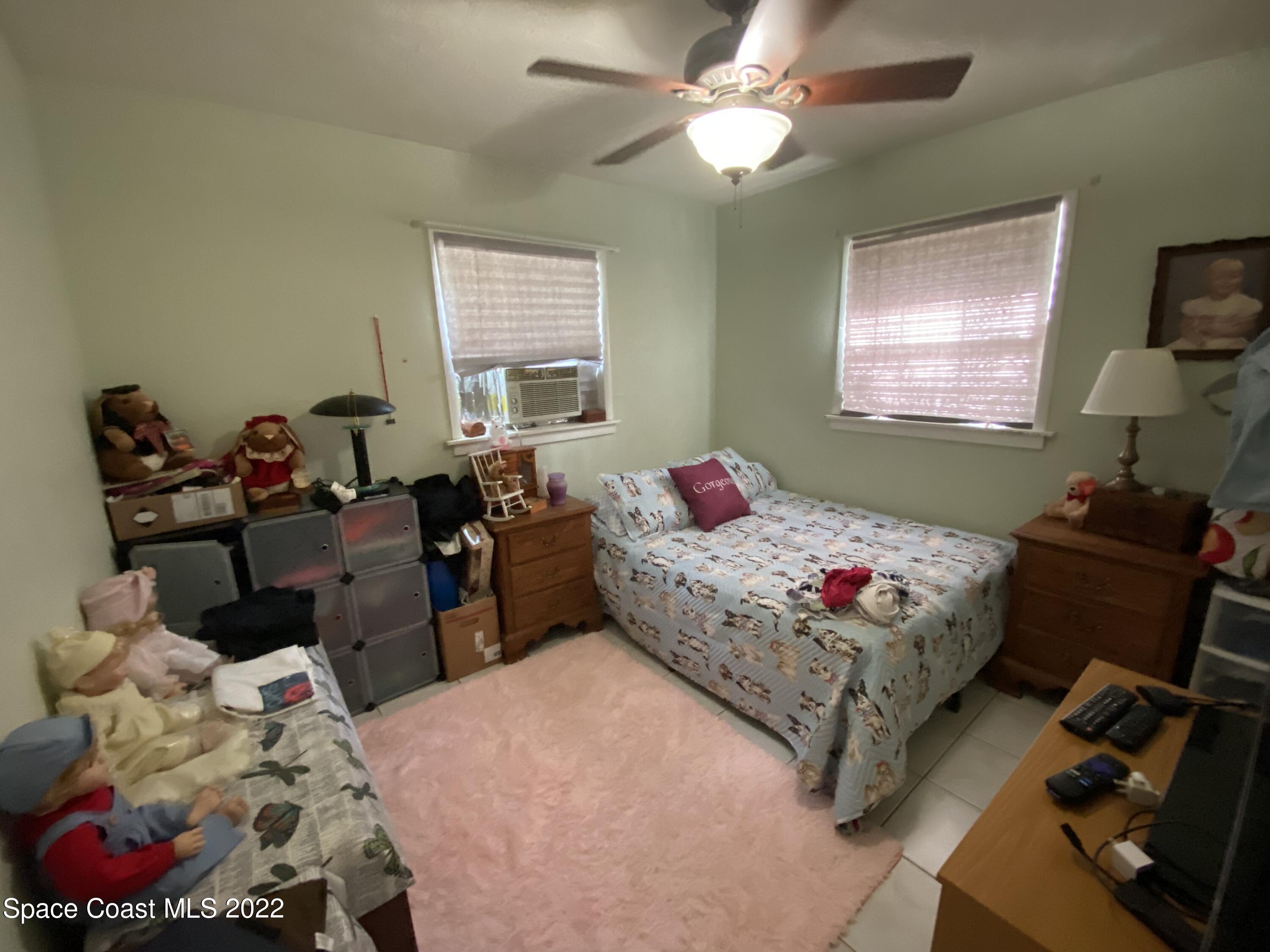 2807 Tropic Road Melbourne, FL 32935 - Photo 10 of 24 a bedroom with bed and a window