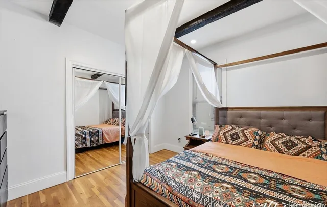 a bed room with a bed and a couch