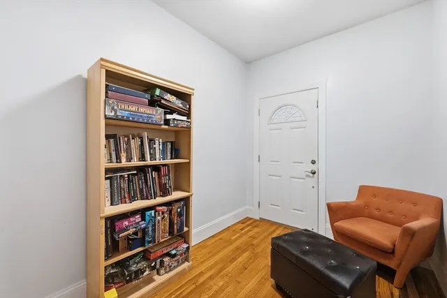 a bedroom with a bed and a book shelf