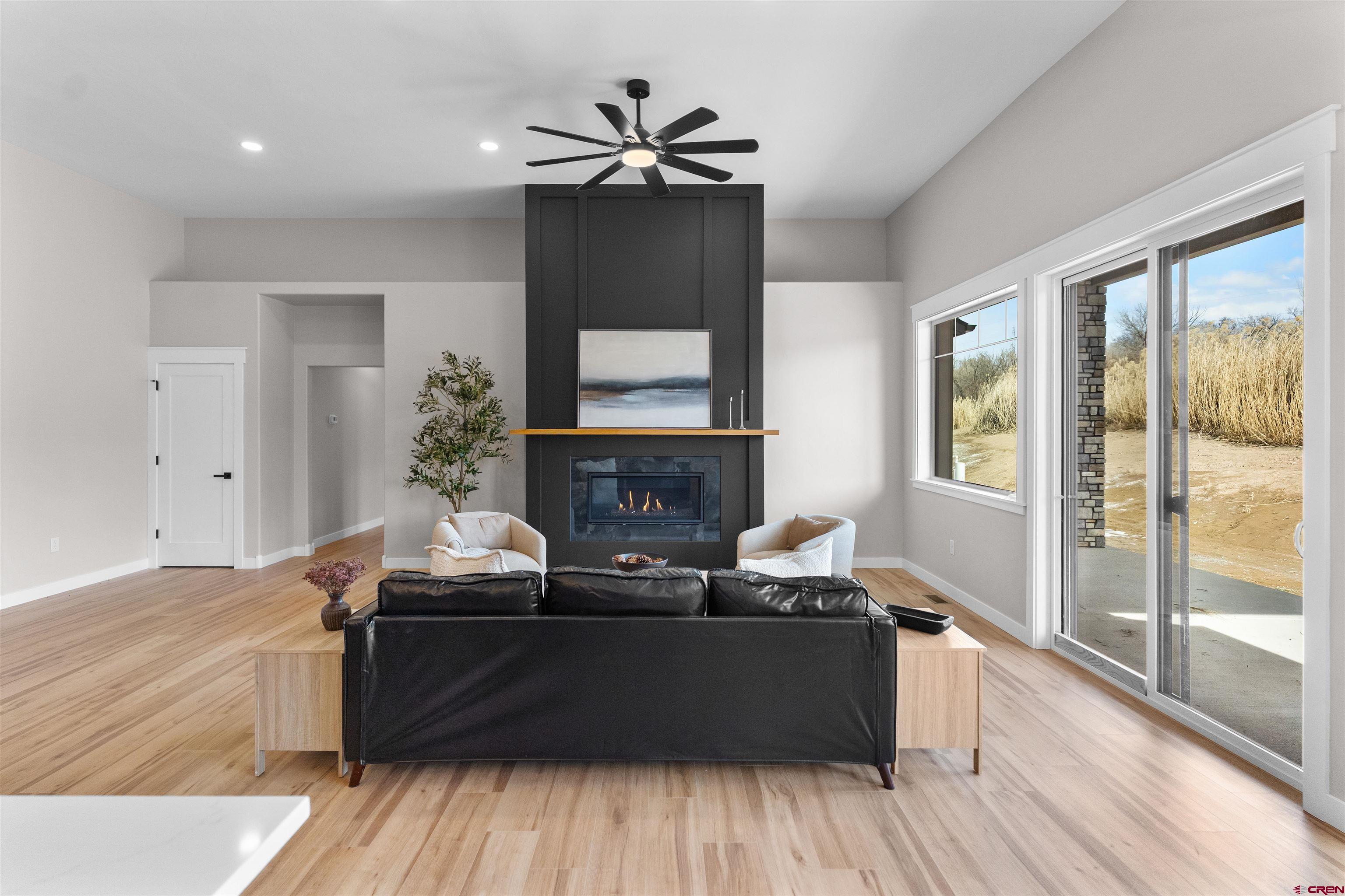 1539 Criterion Street Delta, CO 81416 - Photo 12 of 41 a living room with furniture and a fireplace